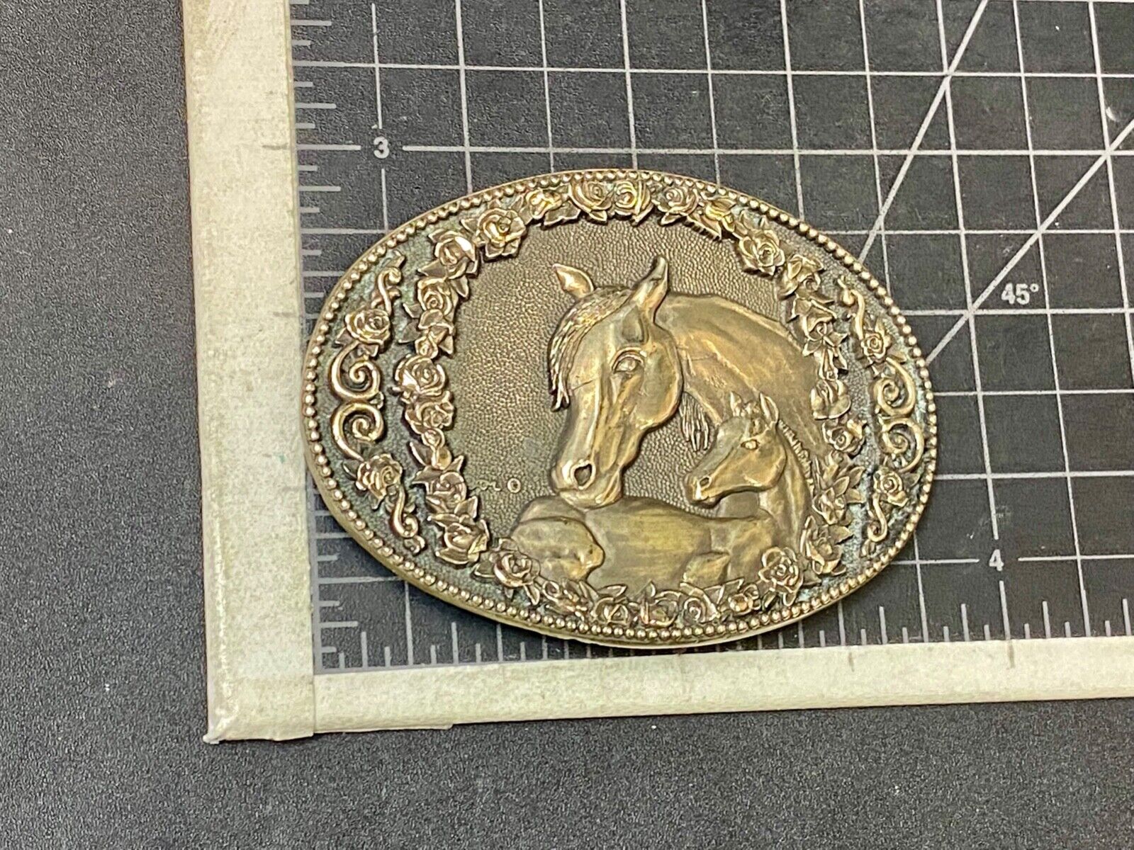 Two horse heads First addition brass belt buckle by Award Design Medals