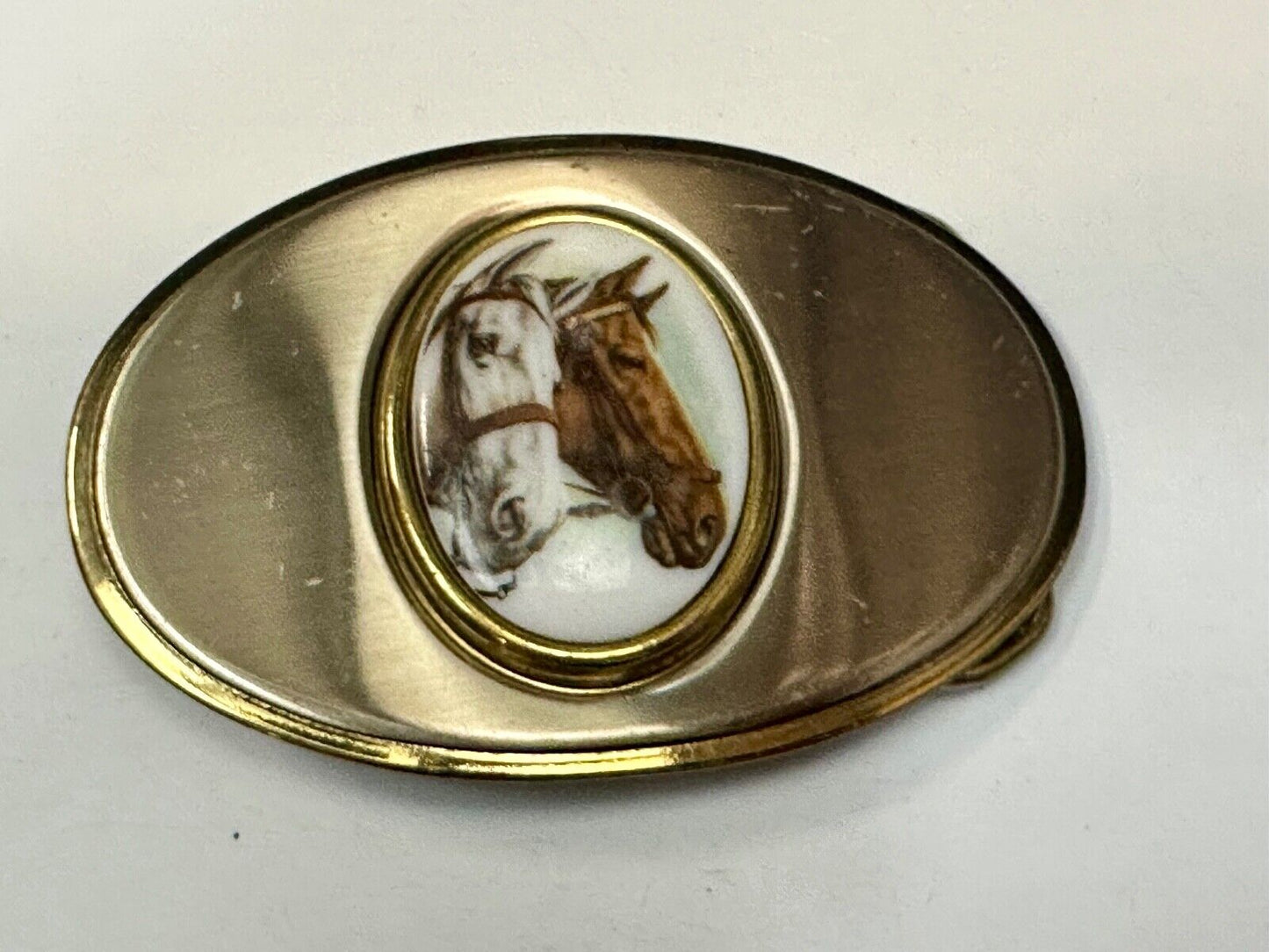 Two horse head picture in oval smooth gold tone Vintage Belt Buckle