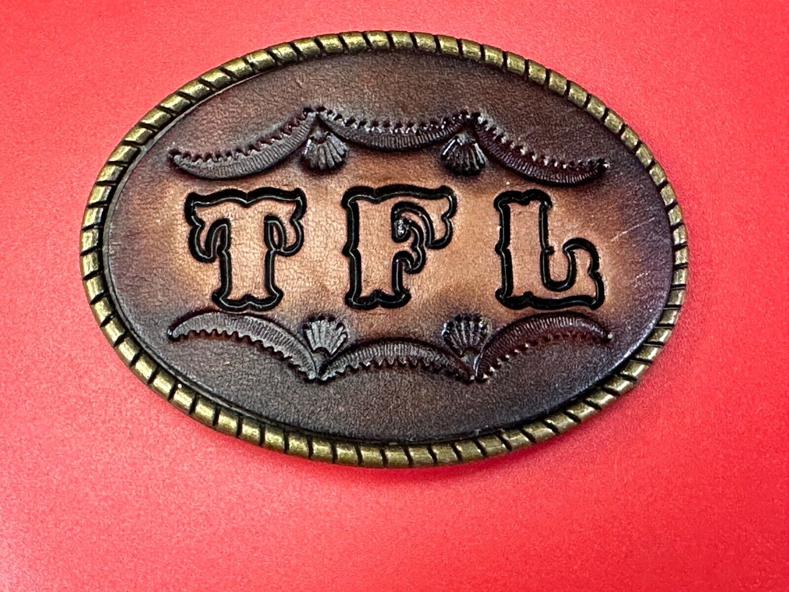 TFL.  vintage western initials letters on leather belt buckle