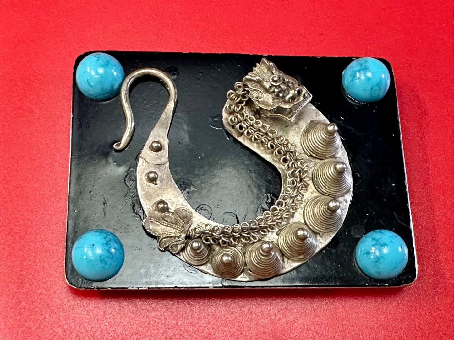 Artisan Dragon theme rectangular belt buckle with turquoise colored corner accts