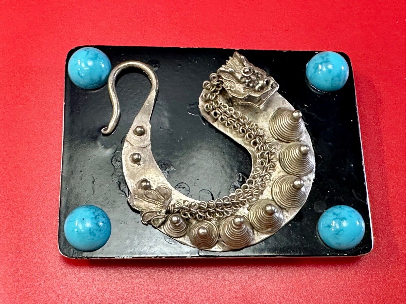 Artisan Dragon theme rectangular belt buckle with turquoise colored corner accts