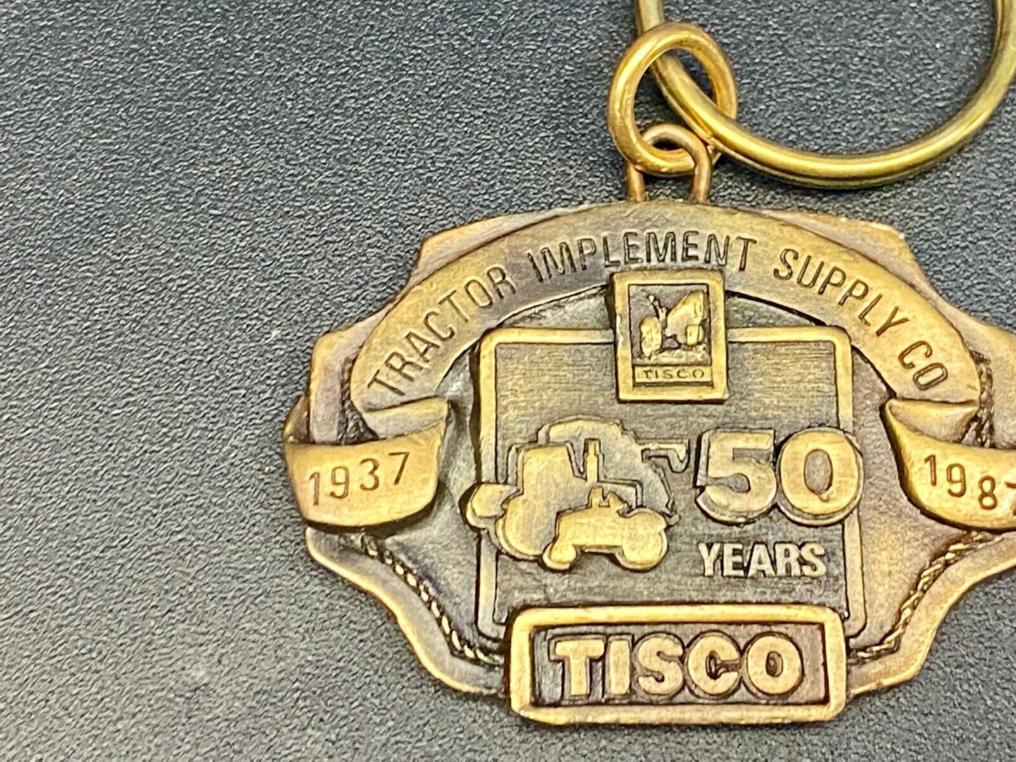 TISCO Tractor Implement Supply Co 50 year celebration NOS Keychain 