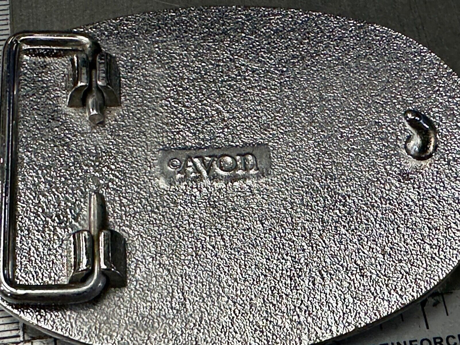 Vintage Cowboy's Horse Saddle ornate flower swirl oval belt buckle by Avon