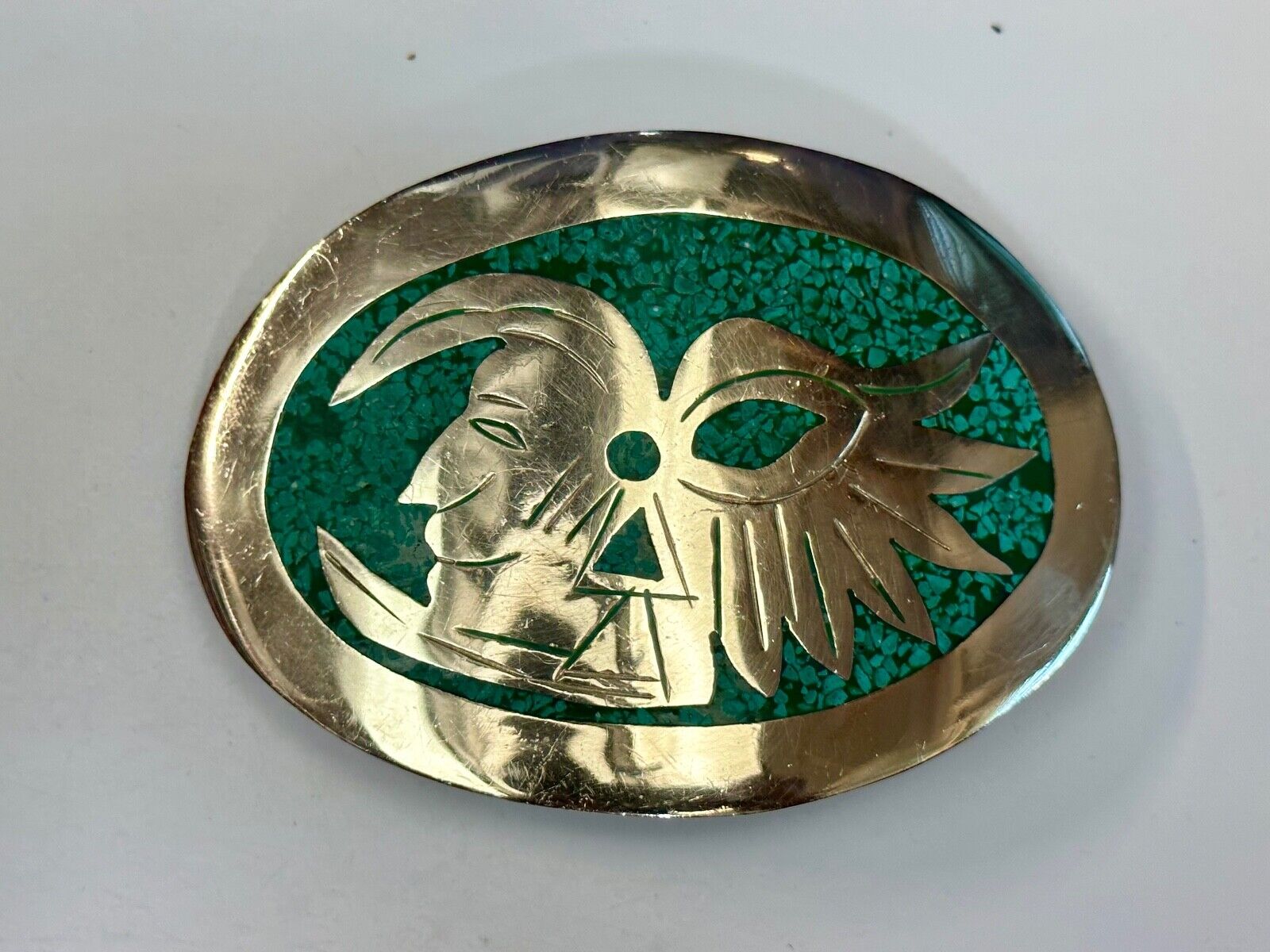 Tribal Face - Inlaid Turquoise chip to Alpaca stamped oval Belt Buckle
