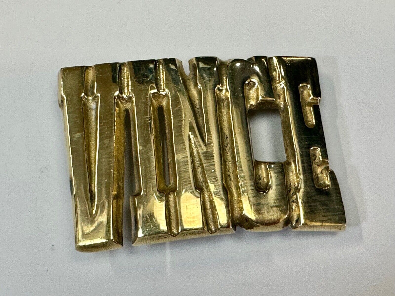 Vince,  Cutout block letters solid brass Vintage belt buckle marked Taiwan ROC