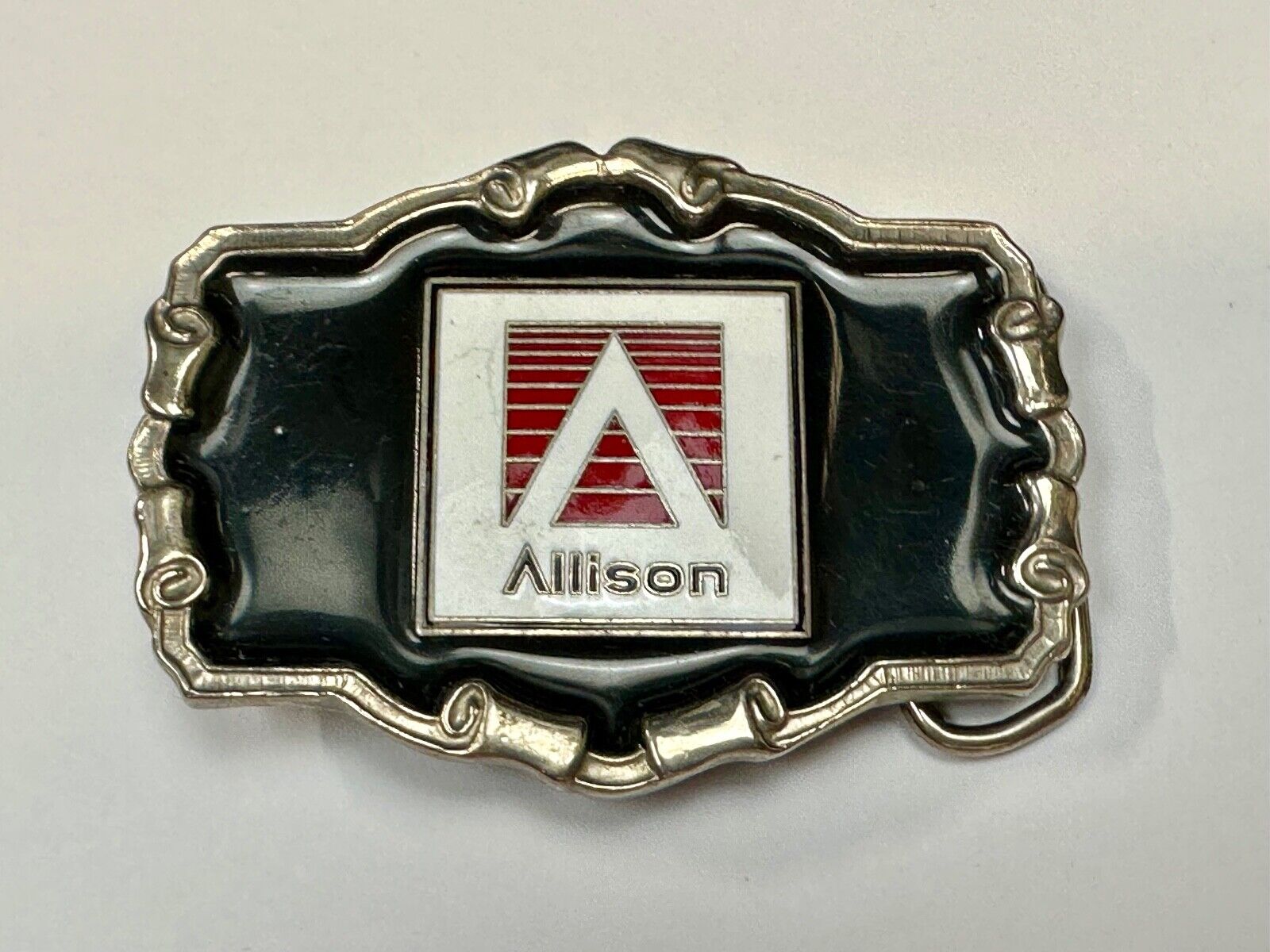 Allison Company logo emblem on western framed black enameled belt buckle