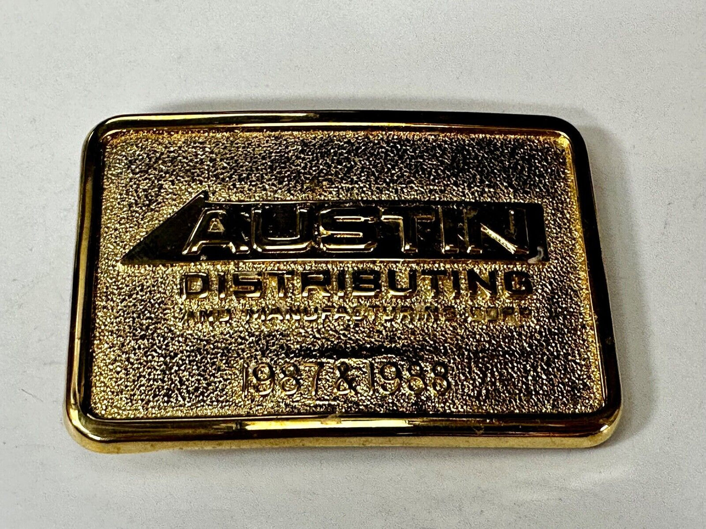 Austin Texas Distributing and Manufacturing 1987 Gold Tone Belt Buckle