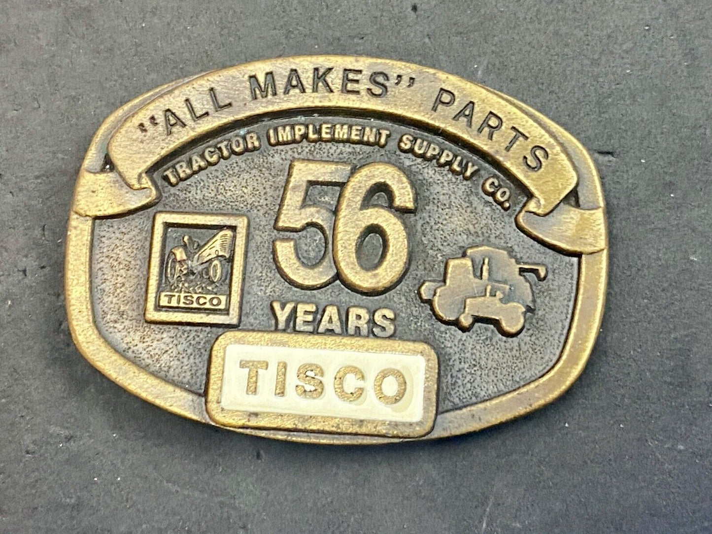 TISCO 56 Years ALL MAKES PARTS Tractor Service belt buckle Series 4 1993 