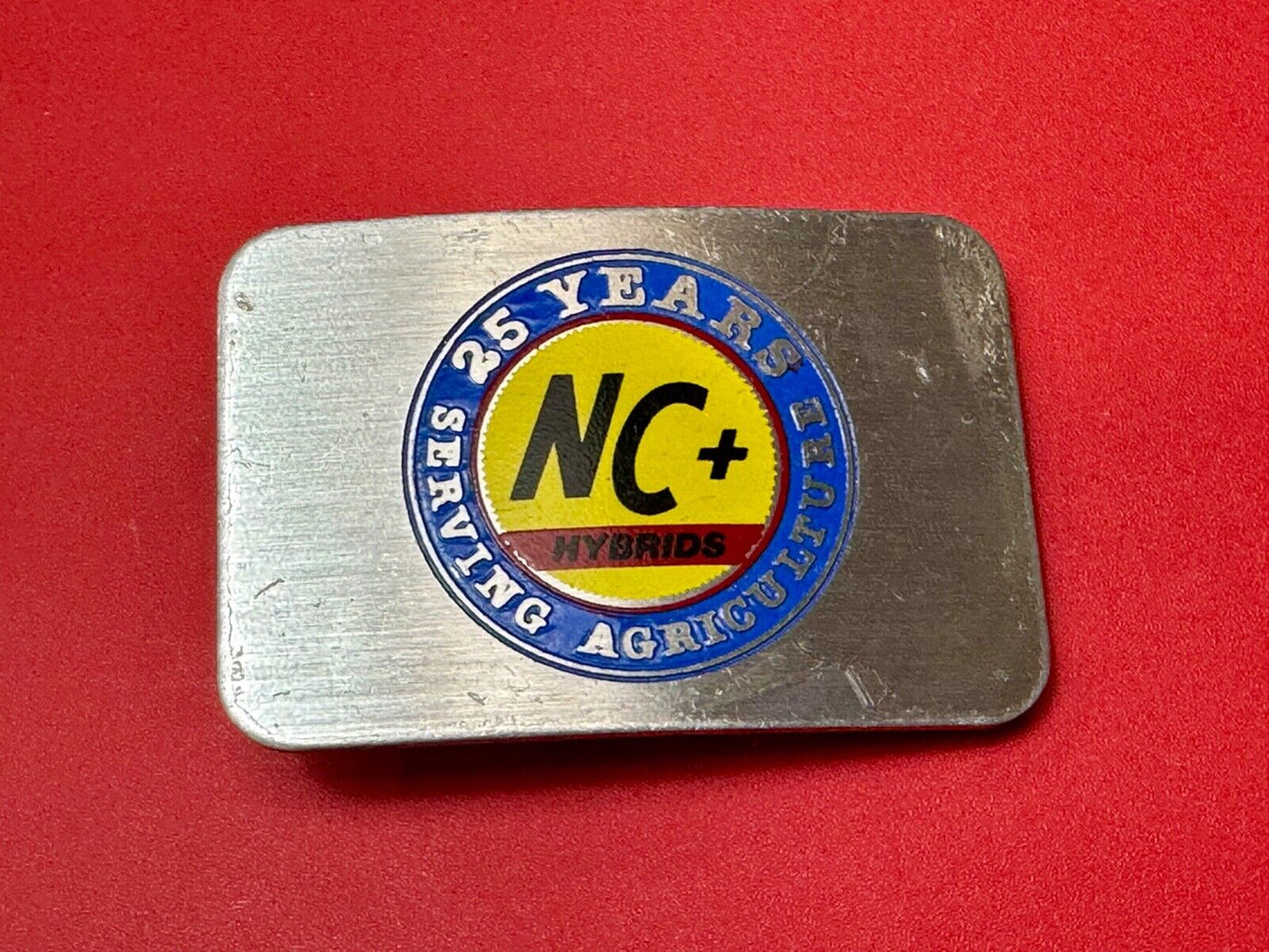 25 years serving agriculture - NC+ Hybrids Farmers Agriculture belt buckle