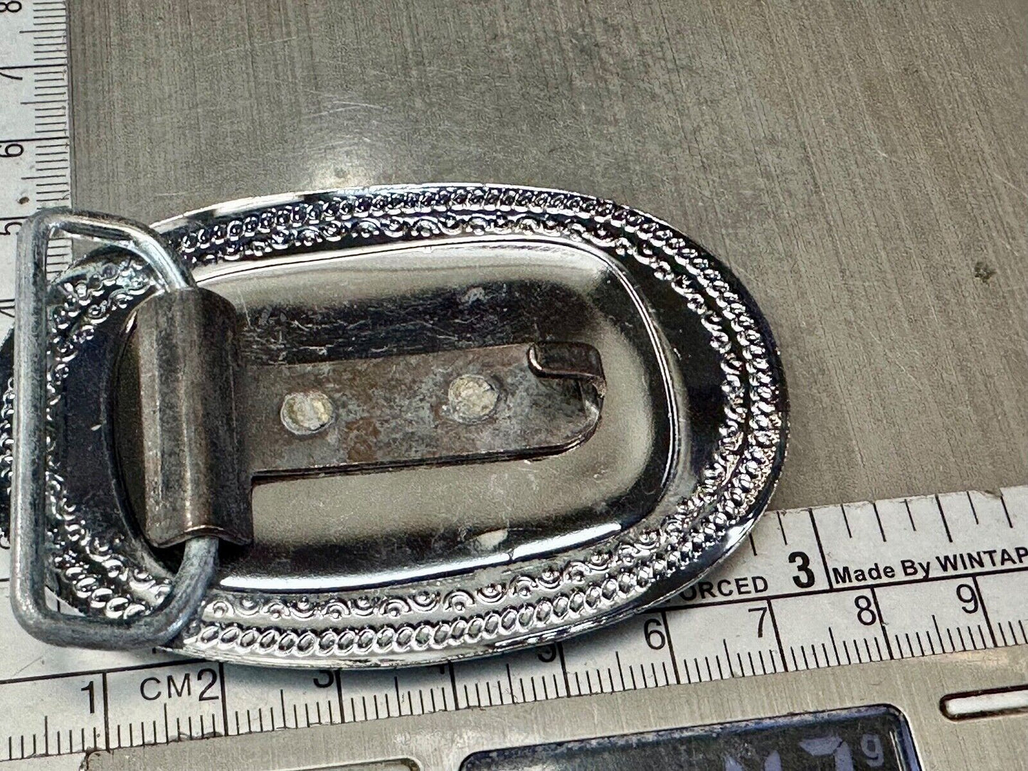 70s Covered Wagon two tone reflective oval ornate boarder belt buckle