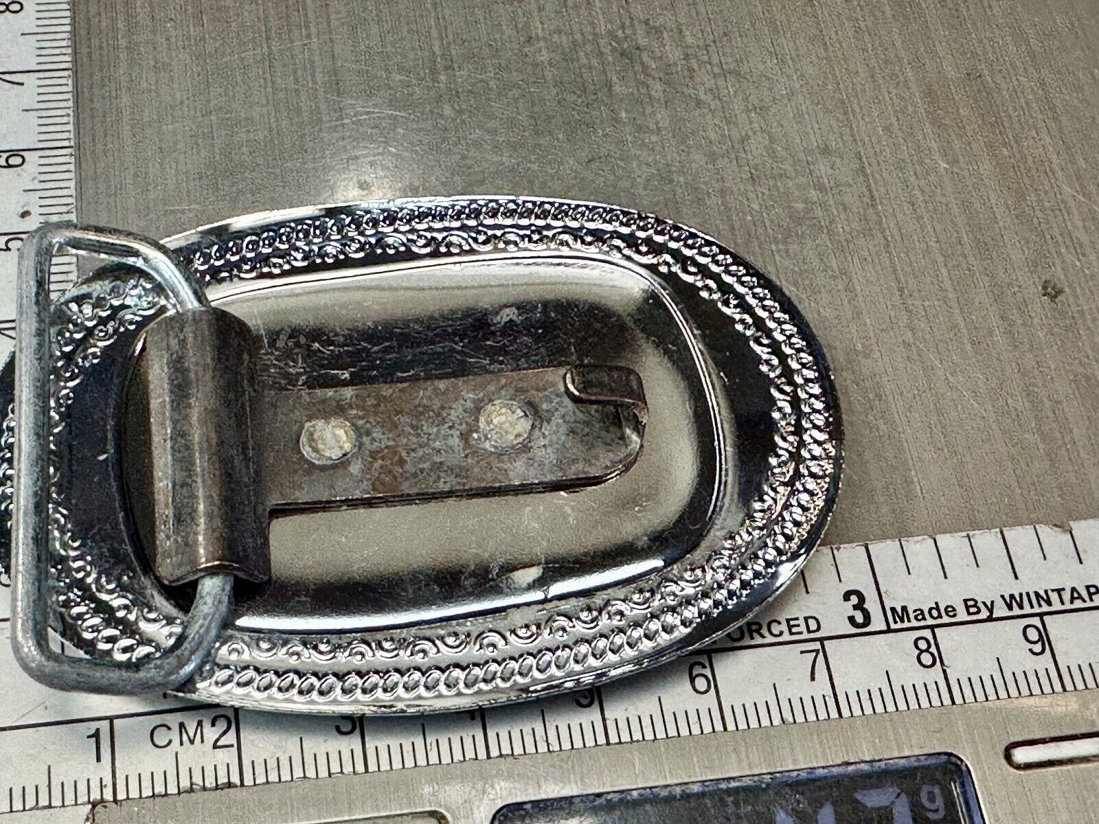 70s Covered Wagon two tone reflective oval ornate boarder belt buckle