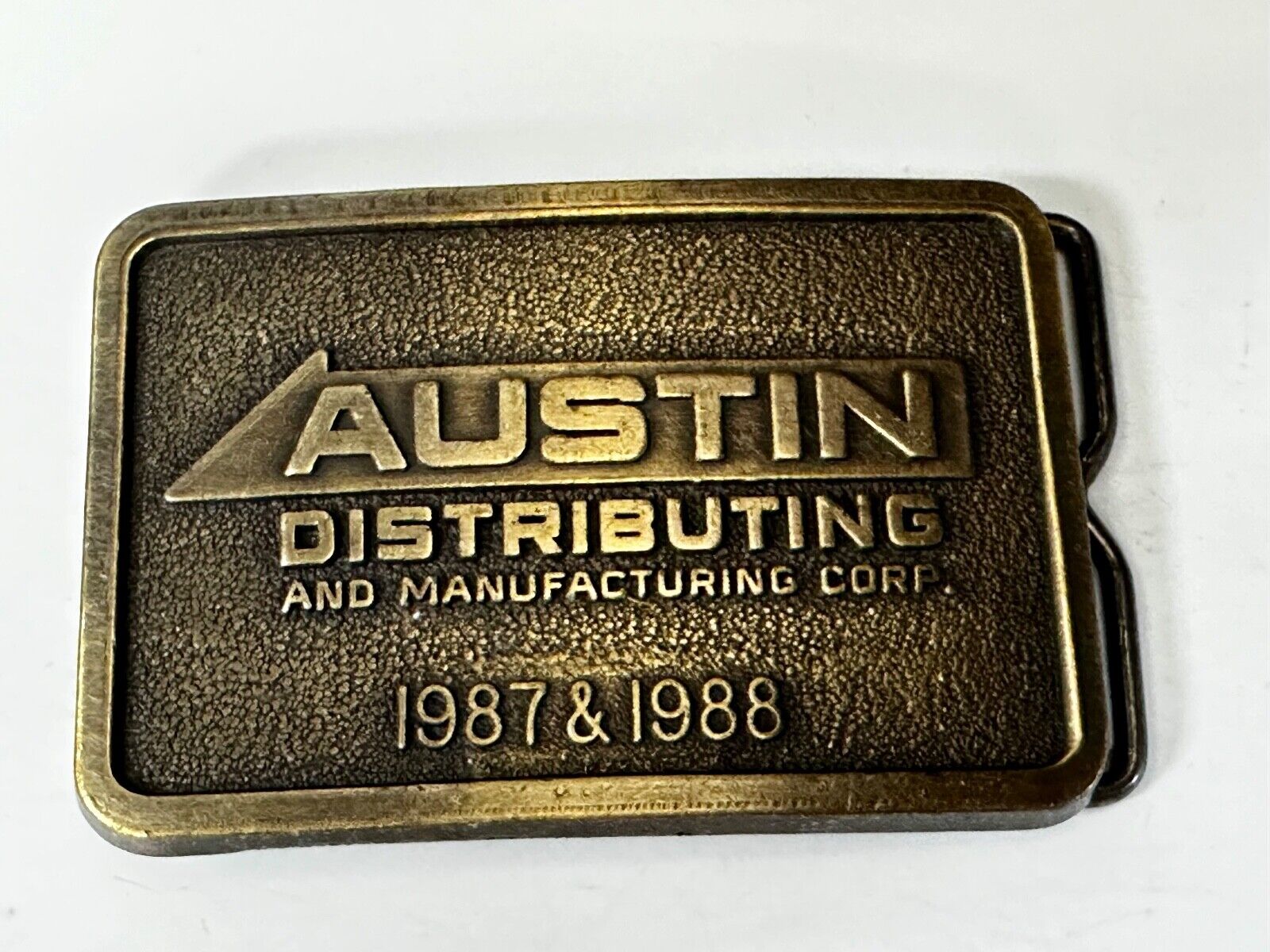Austin Texas Distributing and Manufacturing 1987 Advertisement Promo Belt Buckle
