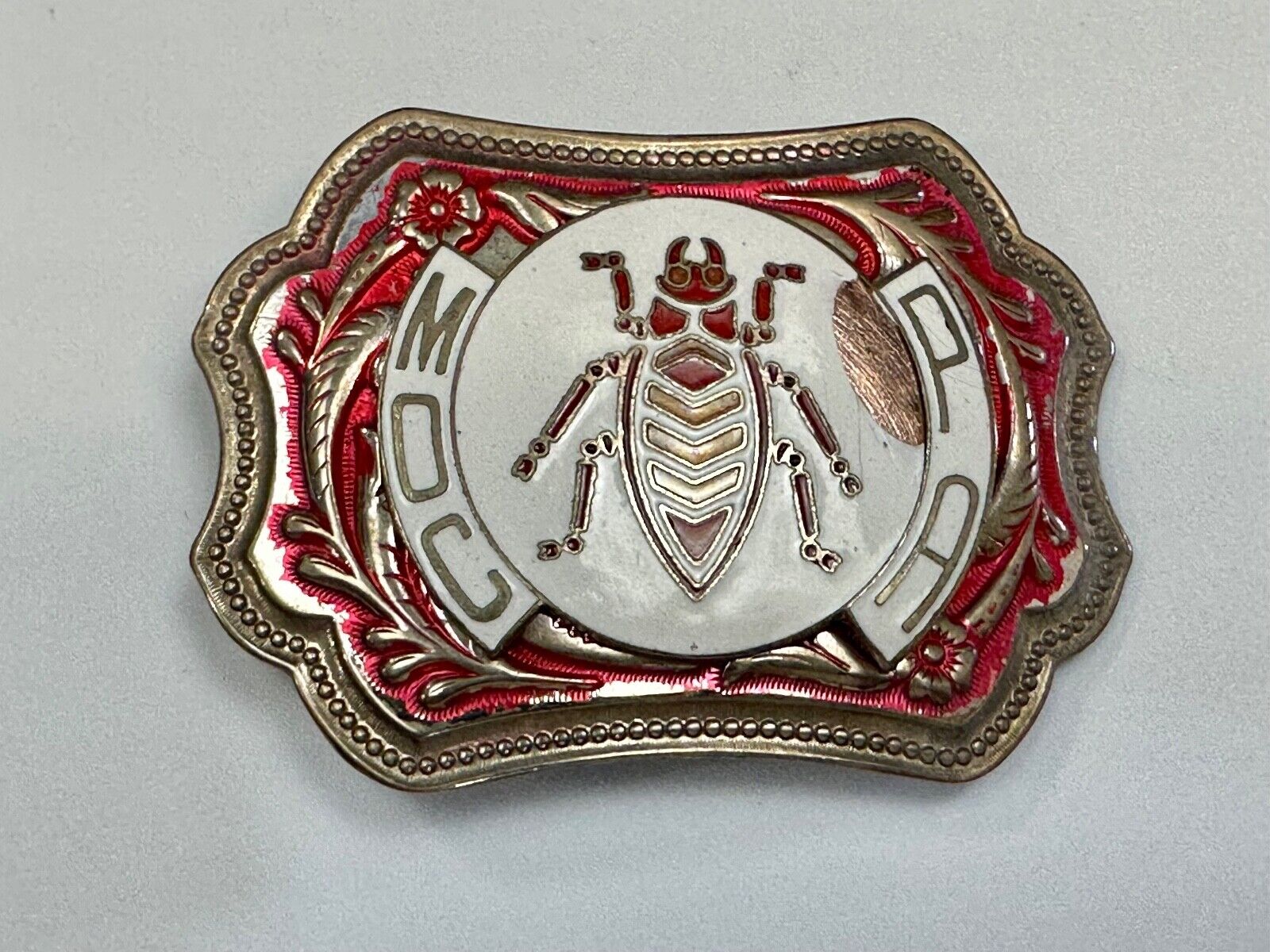 unique insect bug centerpiece on western red & white flower swirl belt buckle