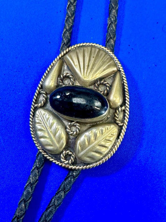 Beautiful Alpaca Mexico bolo tie with dimensional raised leaf's black stone