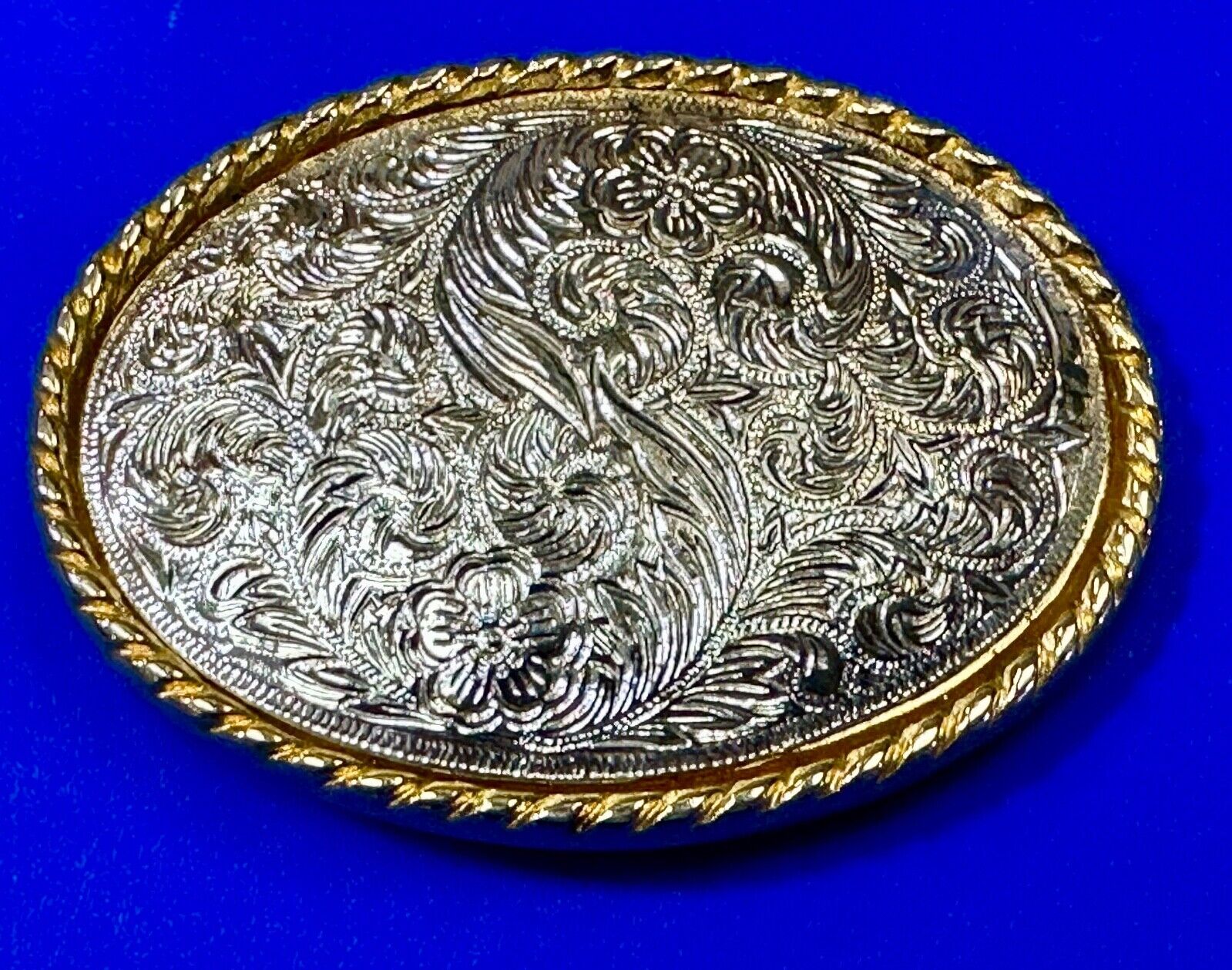 vintage Ivan Brand western flower swirl design two tone oval belt buckle