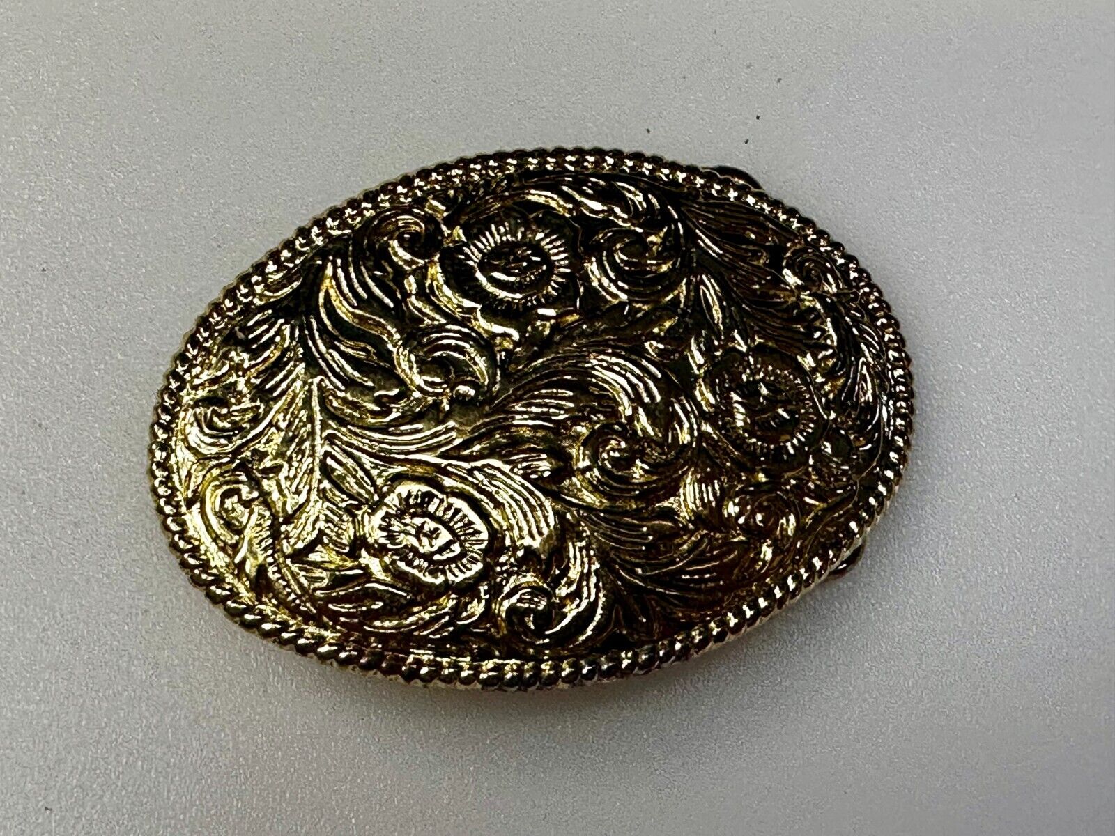 Vintage gold tone western flower swirl design belt buckle