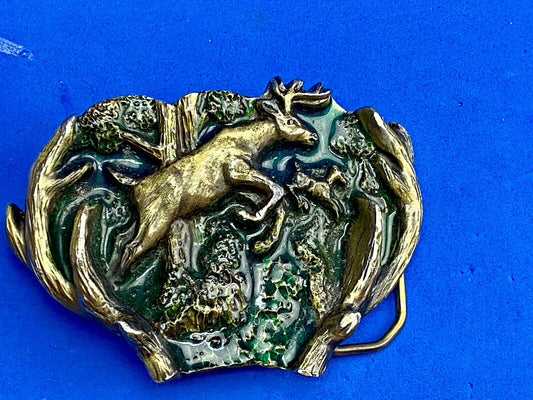 VINTAGE 1982 JUMPING DEER THROUGH ANTLERS - The Great American belt buckle Co. 
