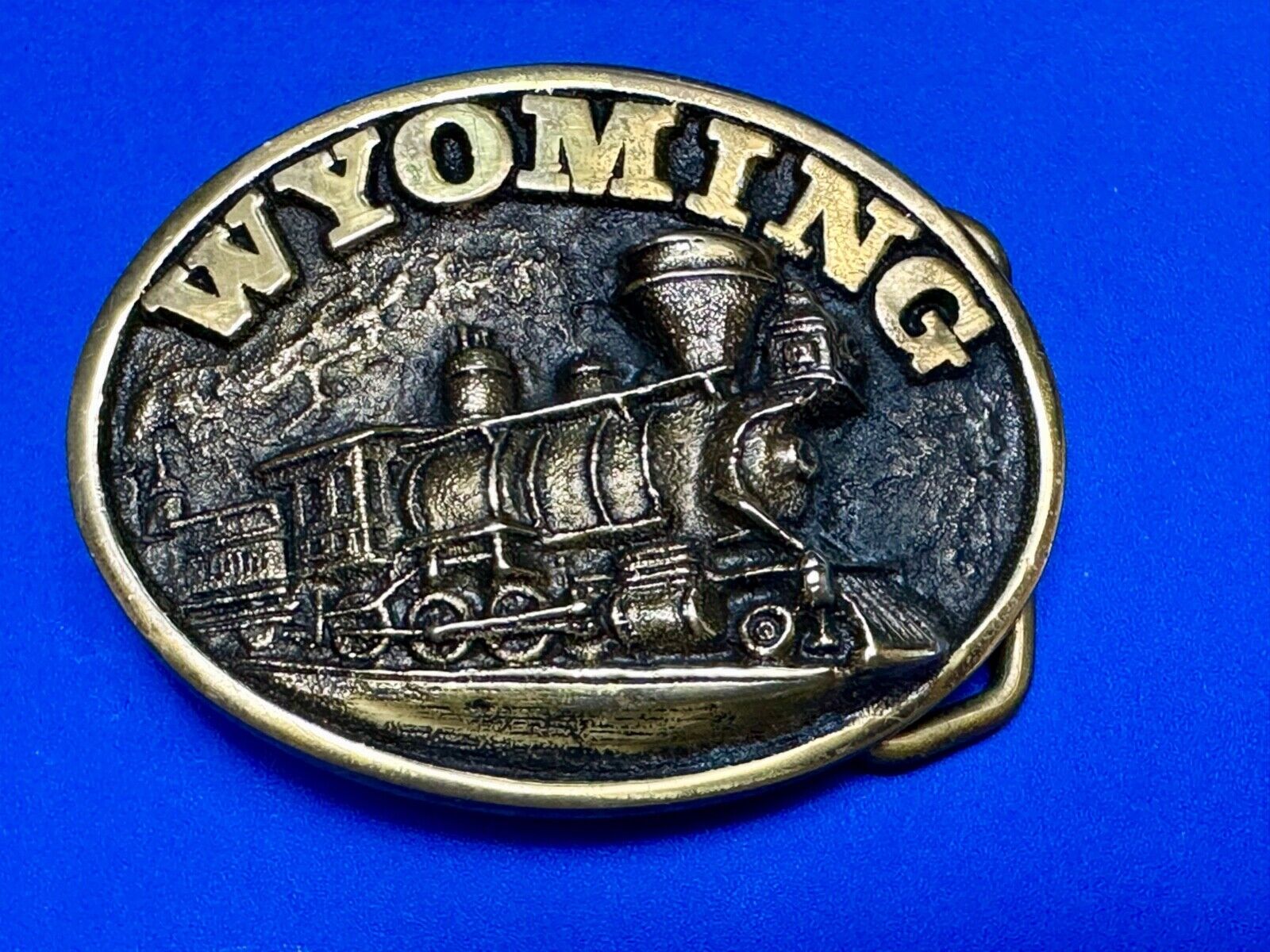 The great state of Wyoming Train History brass belt buckle by Heritage Mint LTD