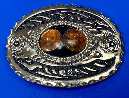 Two lucky pennies coins encased in cab style centerpiece of western belt buckle