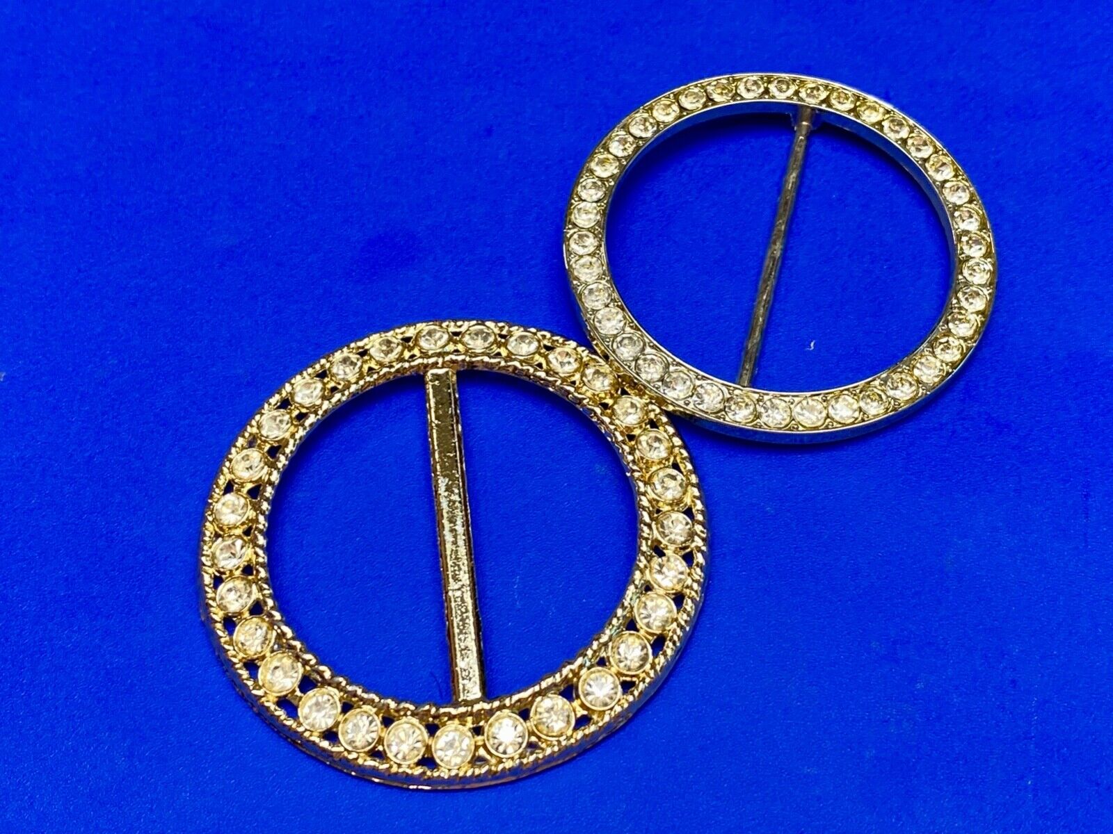 Two piece lot of antique Rhinestone covered round scarf slides