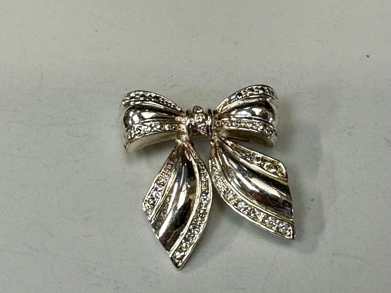 AAI Signed Vintage Brooch Pin 1.5” Bow Crystal Rhinestones Silver Tone
