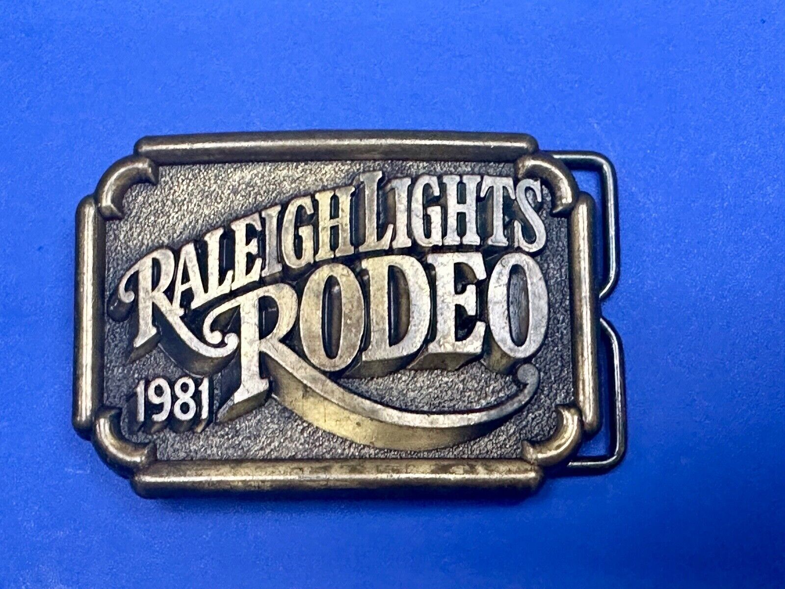 Vintage 1981 Raleigh Lights Rodeo Brass Tone Belt Buckle Advertising Cigarettes