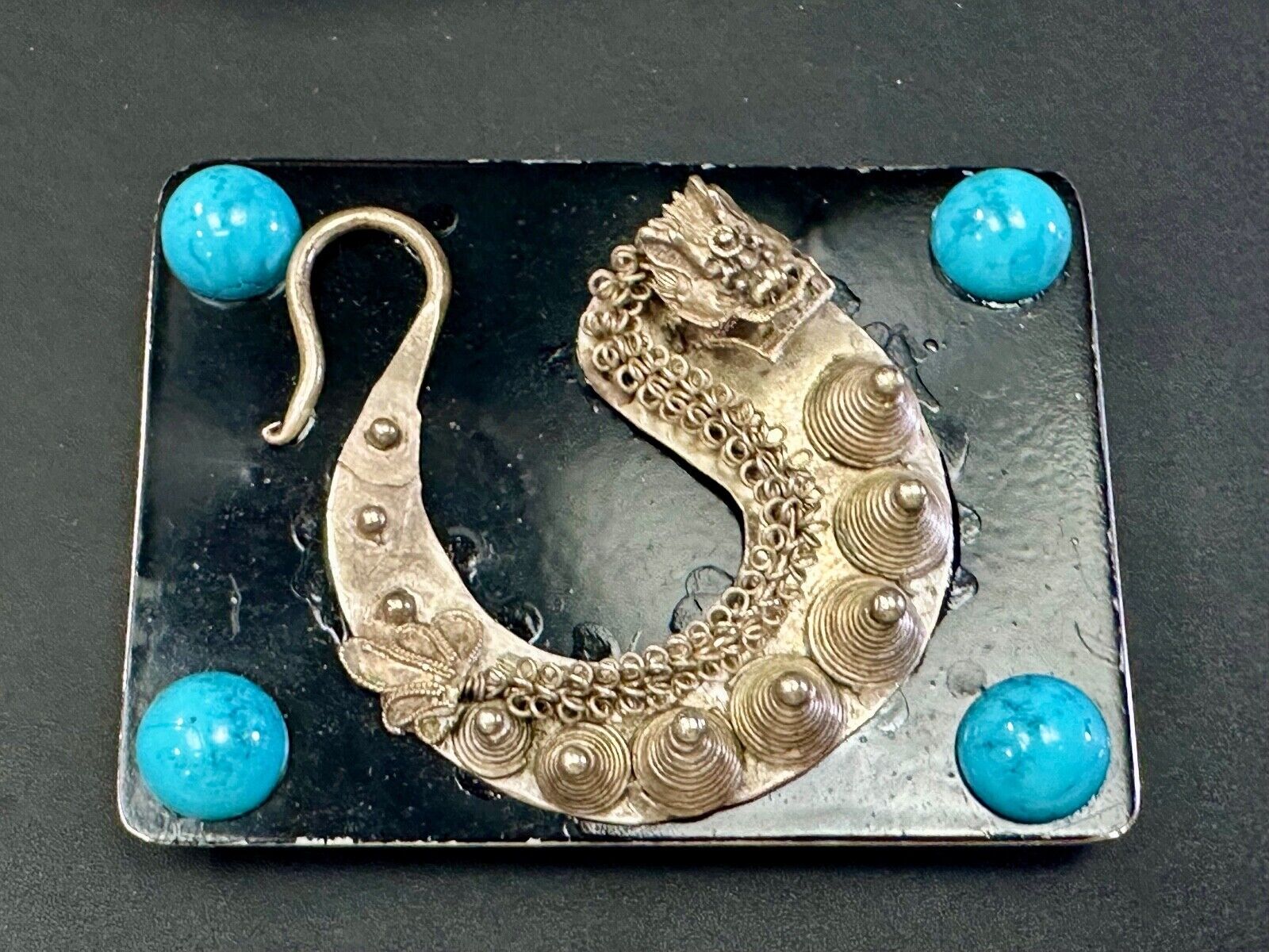 Artisan Dragon theme rectangular belt buckle with turquoise colored corner accts