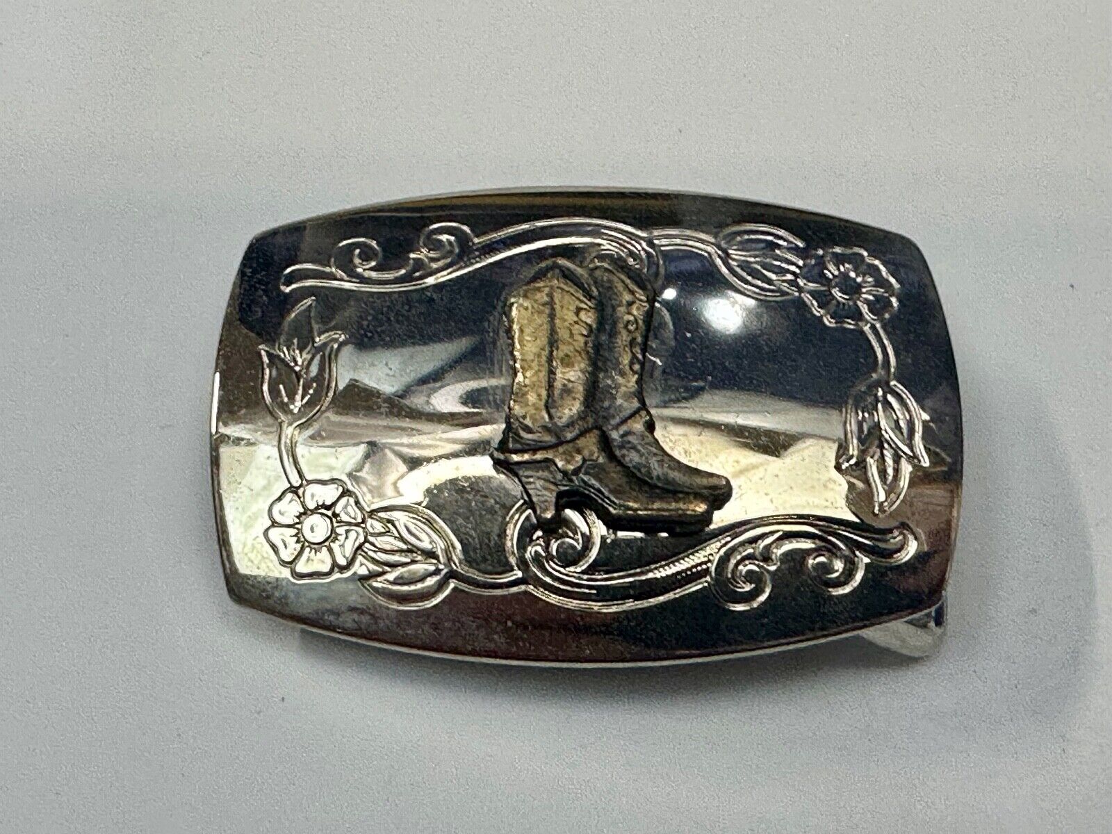 USA made Western Cowboy boots on reflective two tone vintage belt buckle