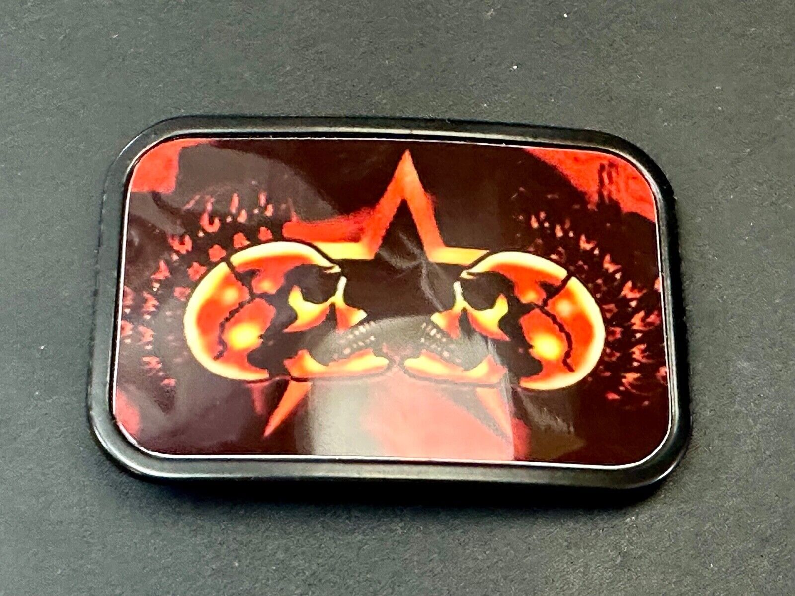 Two Skulls around star picture - black & red color rectangular belt buckle