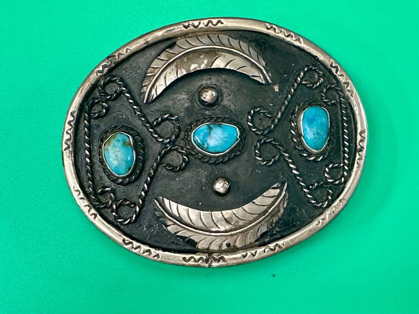 Turquoise stones raised feathers vintage belt buckle marked Sterling 0925 Mexico
