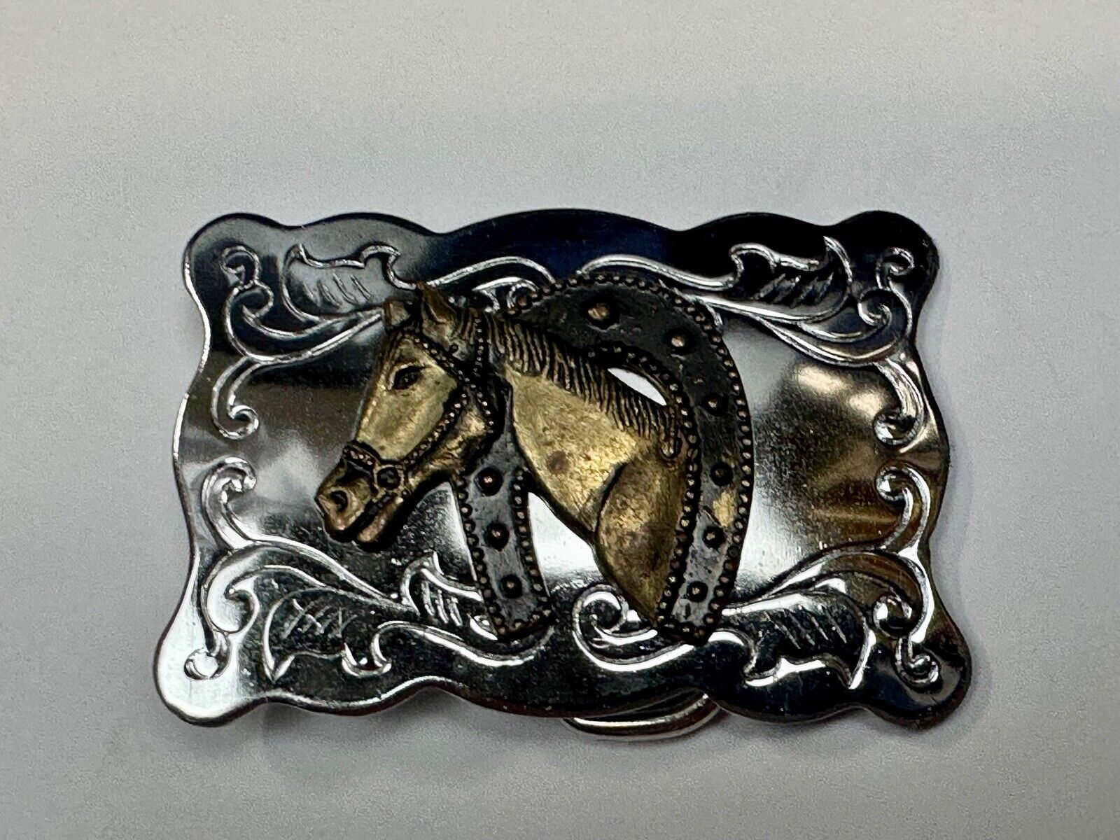 Vintage lucky horseshoe with head centerpiece on western two tone belt buckle