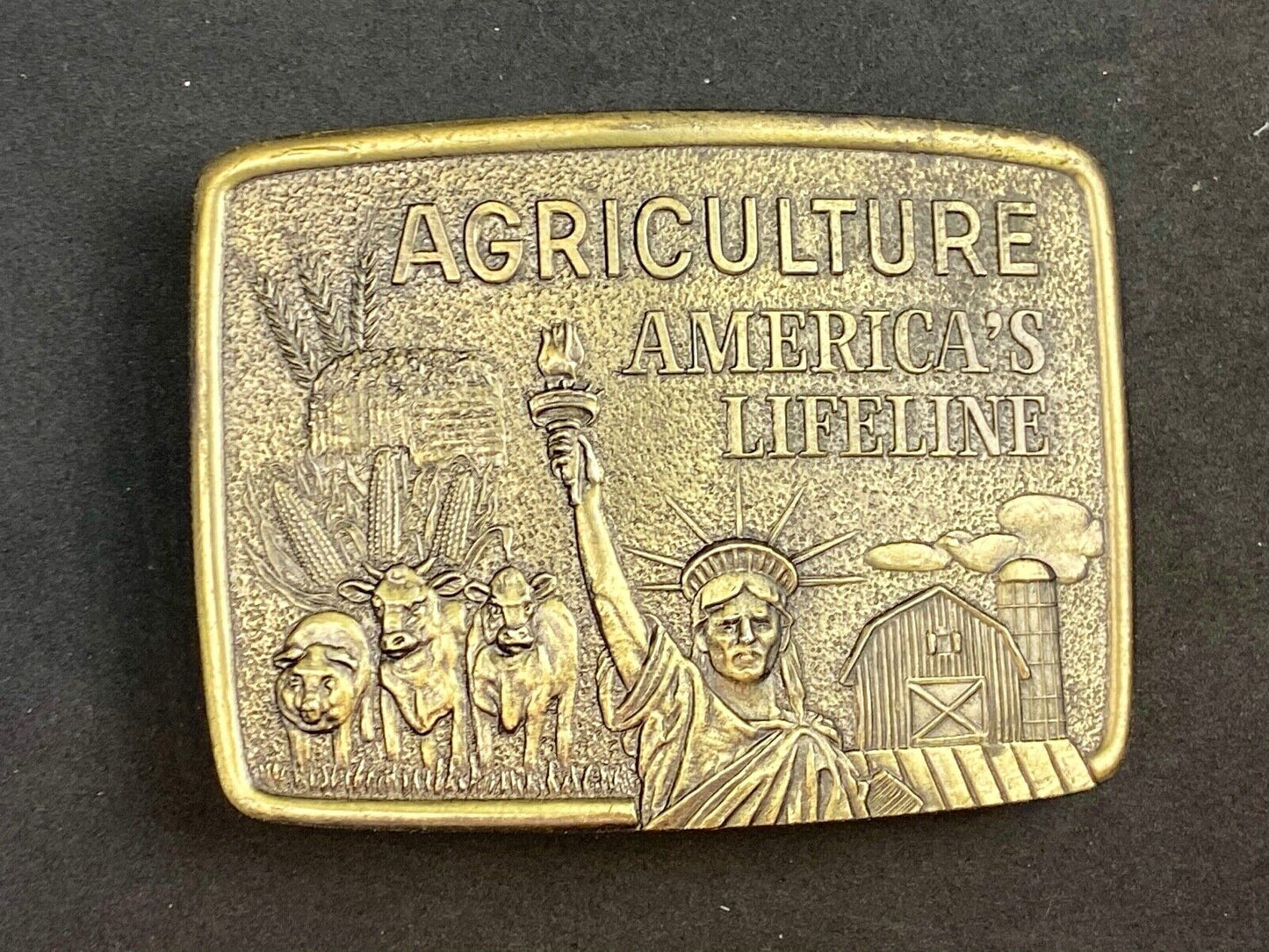 AGRICULTURE, Americas Lifeline belt buckle by Farmhand - Statue of liberty 