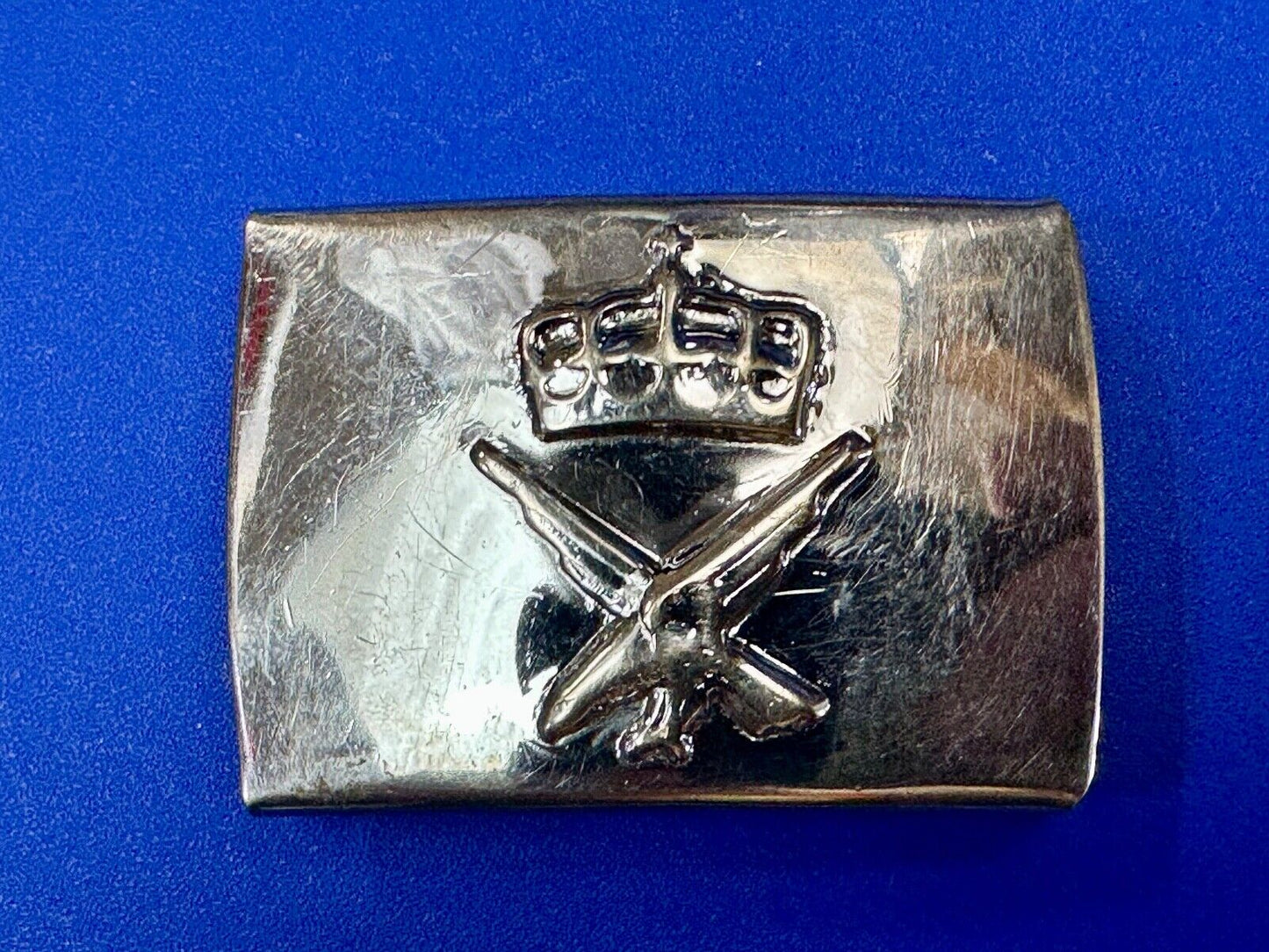unknown to me!   dress style silver tone crown X crest? stamped belt buckle
