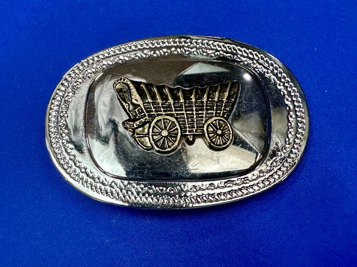 70s Covered Wagon two tone reflective oval ornate boarder belt buckle