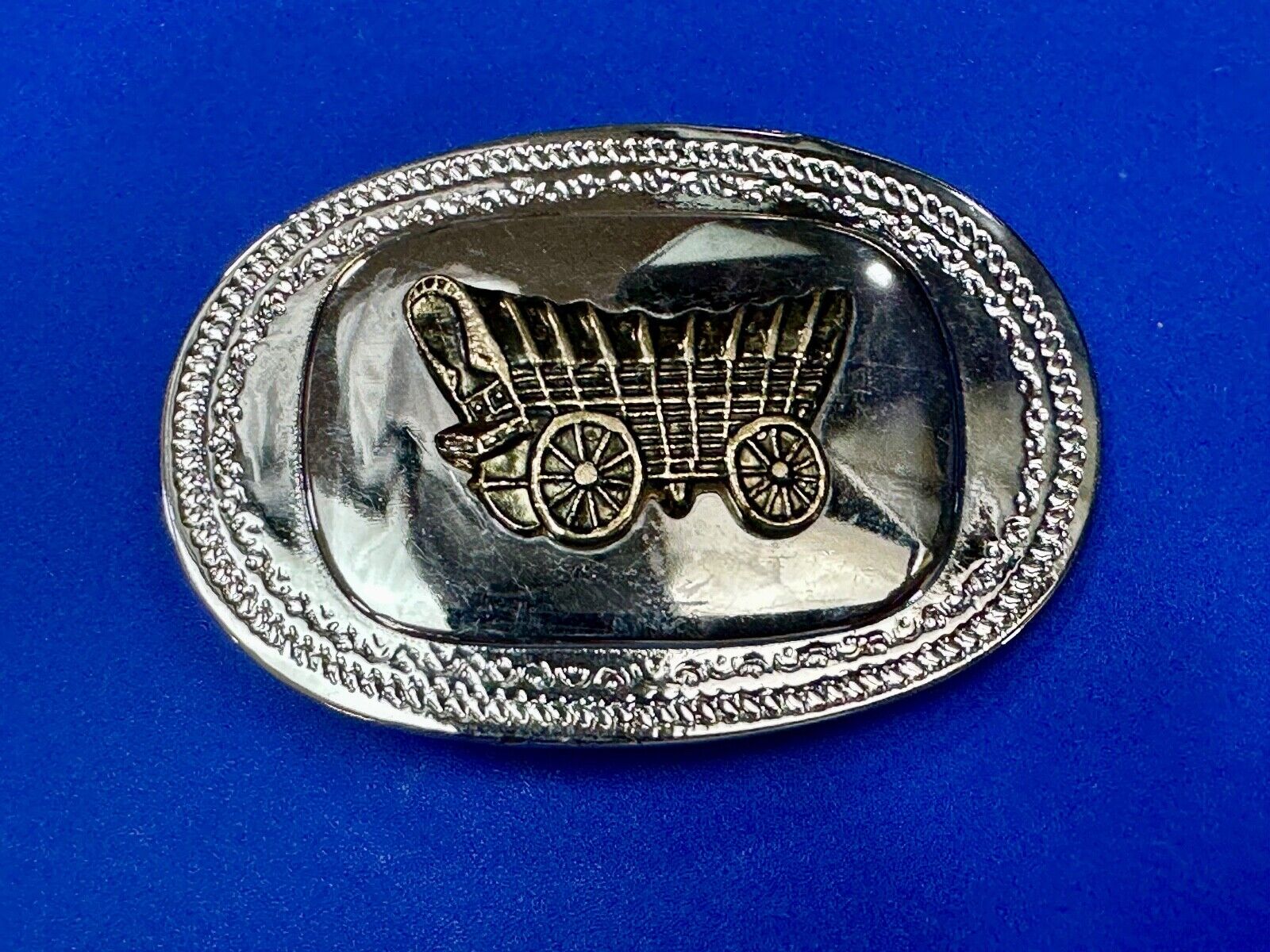 70s Covered Wagon two tone reflective oval ornate boarder belt buckle
