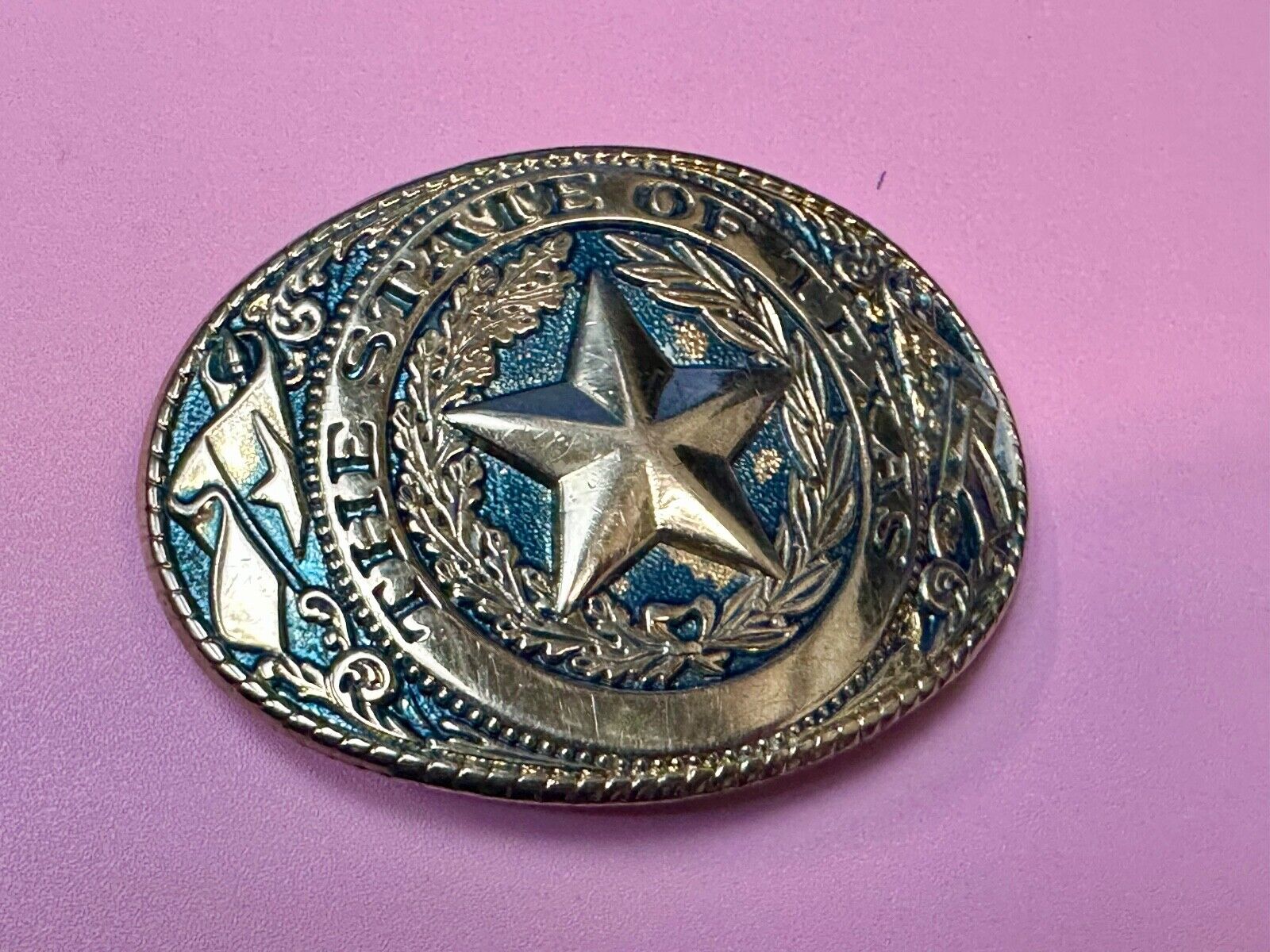 The Great State of Texas - gold color star belt buckle with blue colored accents