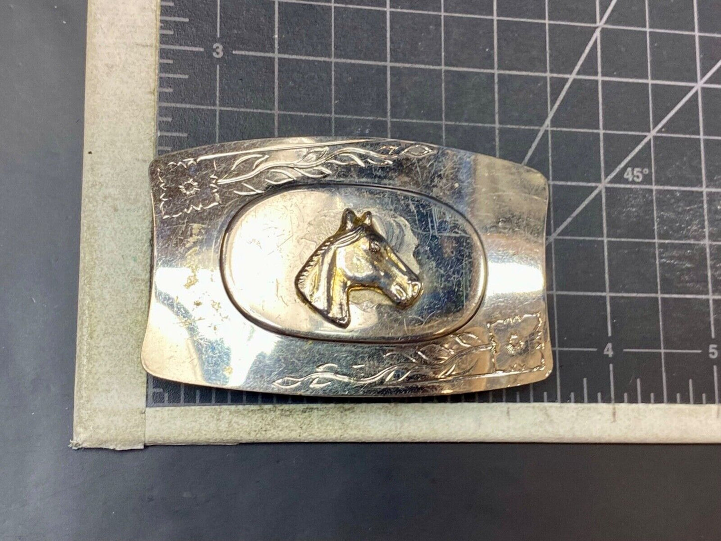 Vintage horse head on western belt buckle