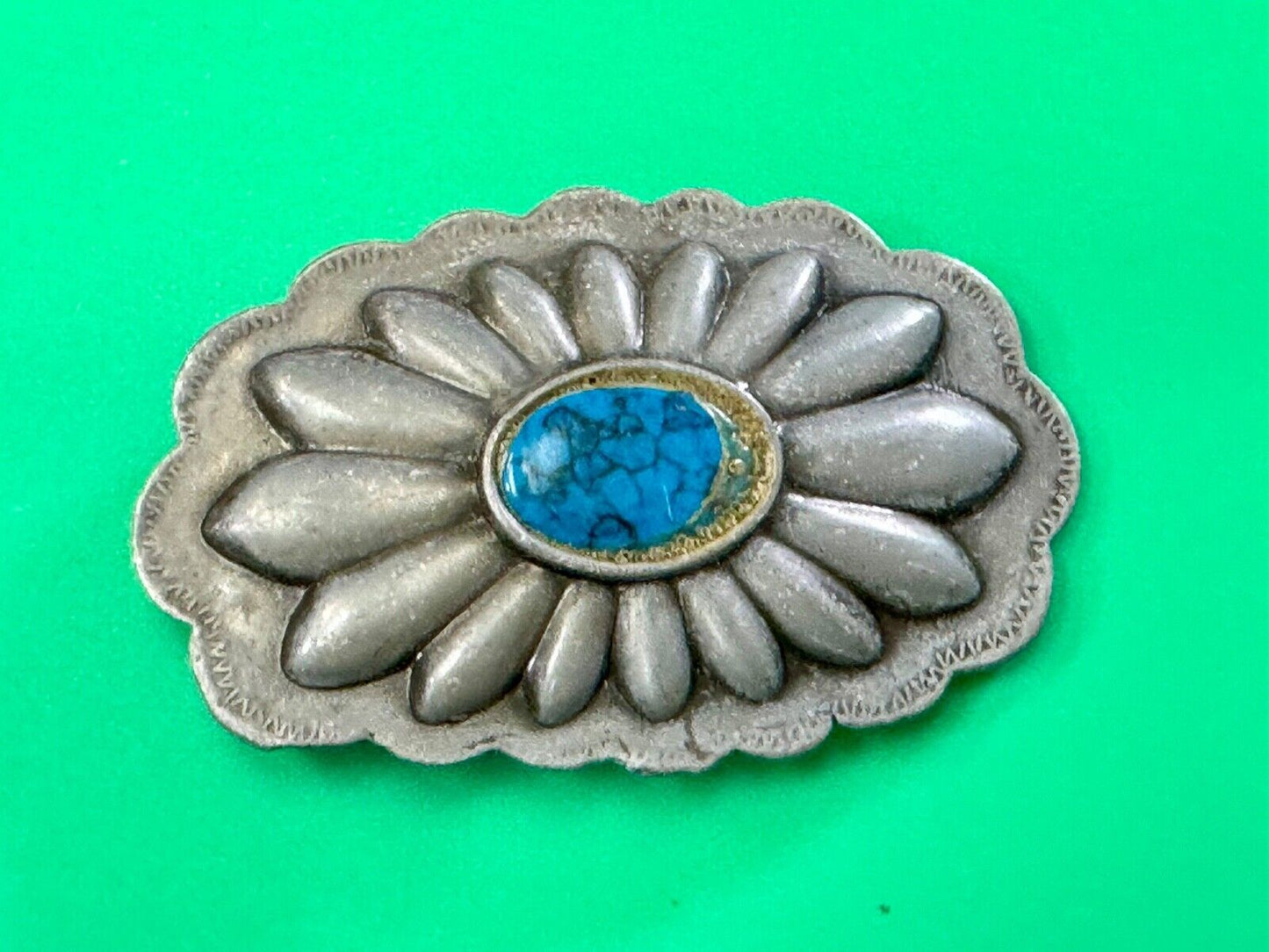 Turquoise stone centered on Vintage metal flower theme belt buckle