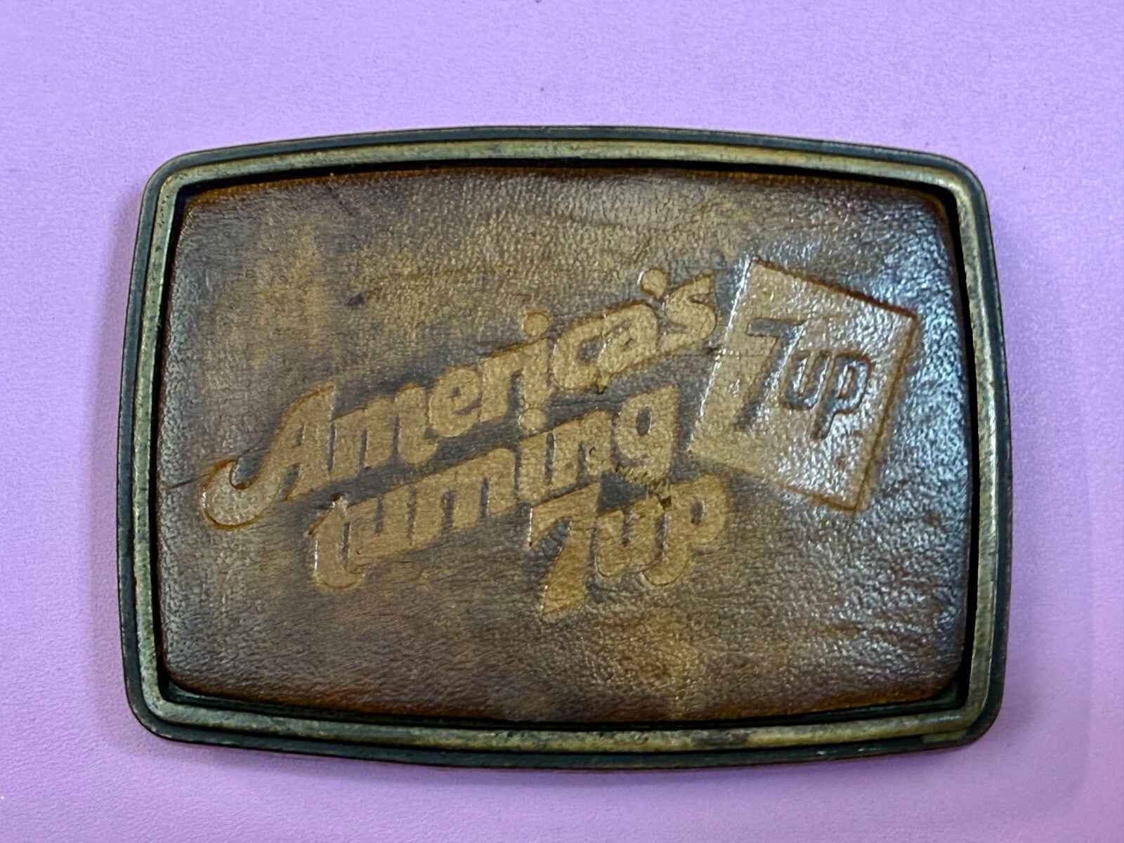 America's Turning 7up Embossed Leather on Metal Advertising Promo Belt Buckle