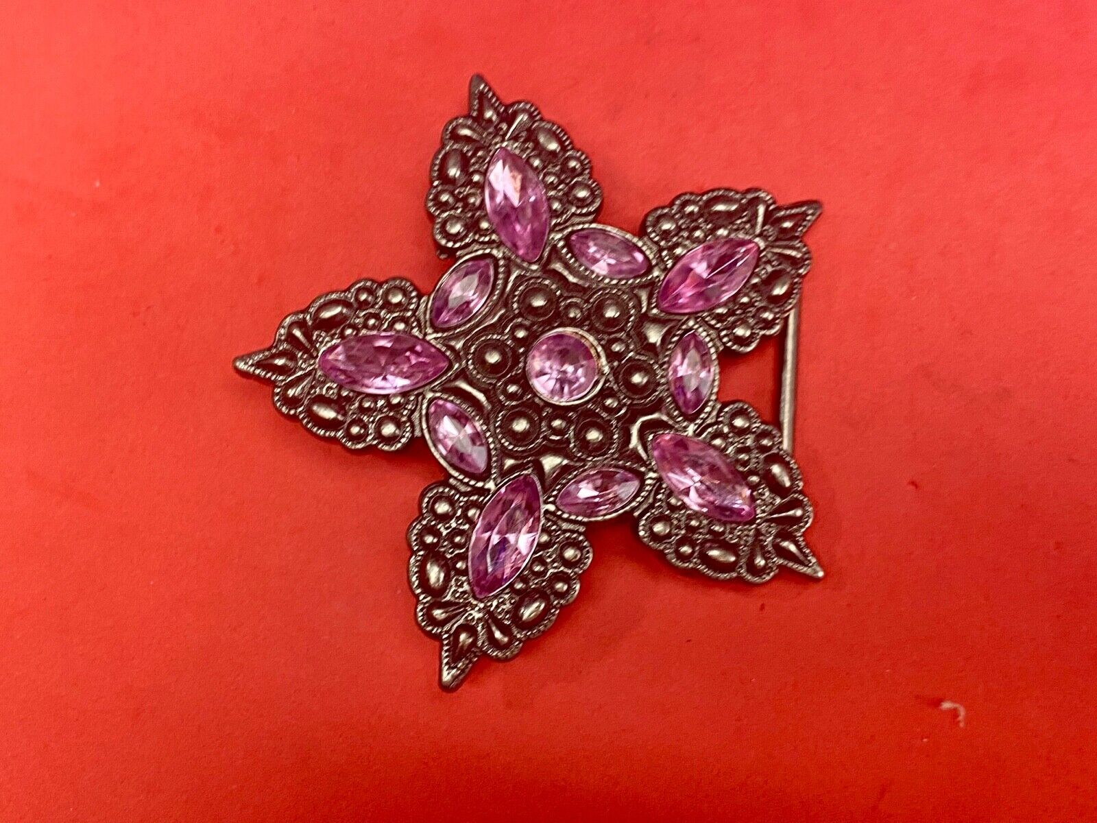 Beautiful figural star with pink accent rhinestones 
