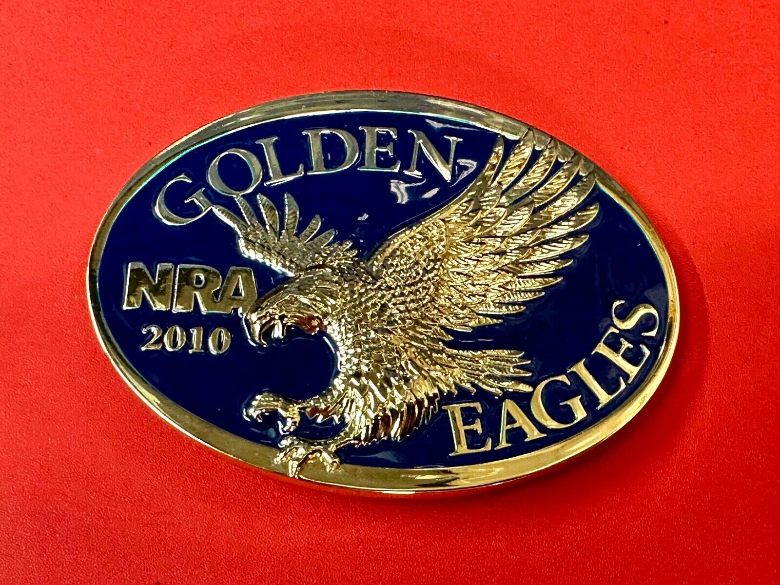 2010 NRA National Rifle Association Golden Eagle blue ribbon belt buckle in box