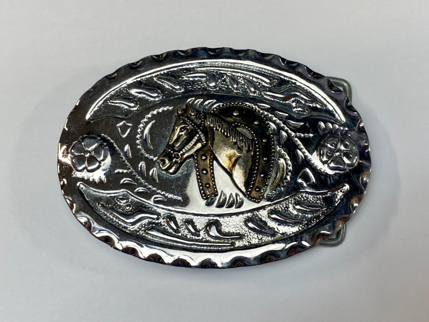 Vintage horse head through lucky horseshoe on mixed metal western belt buckle