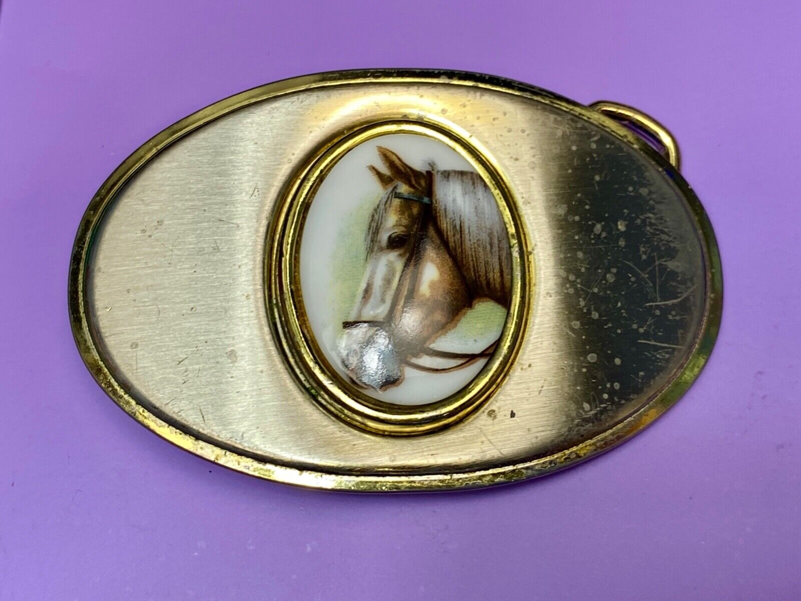 Vintage horse head picture centered in western belt buckle