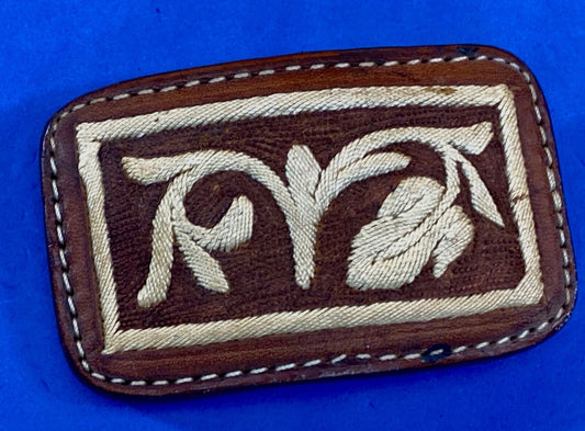 Vintage embroidered flower theme on brown leather belt buckle
