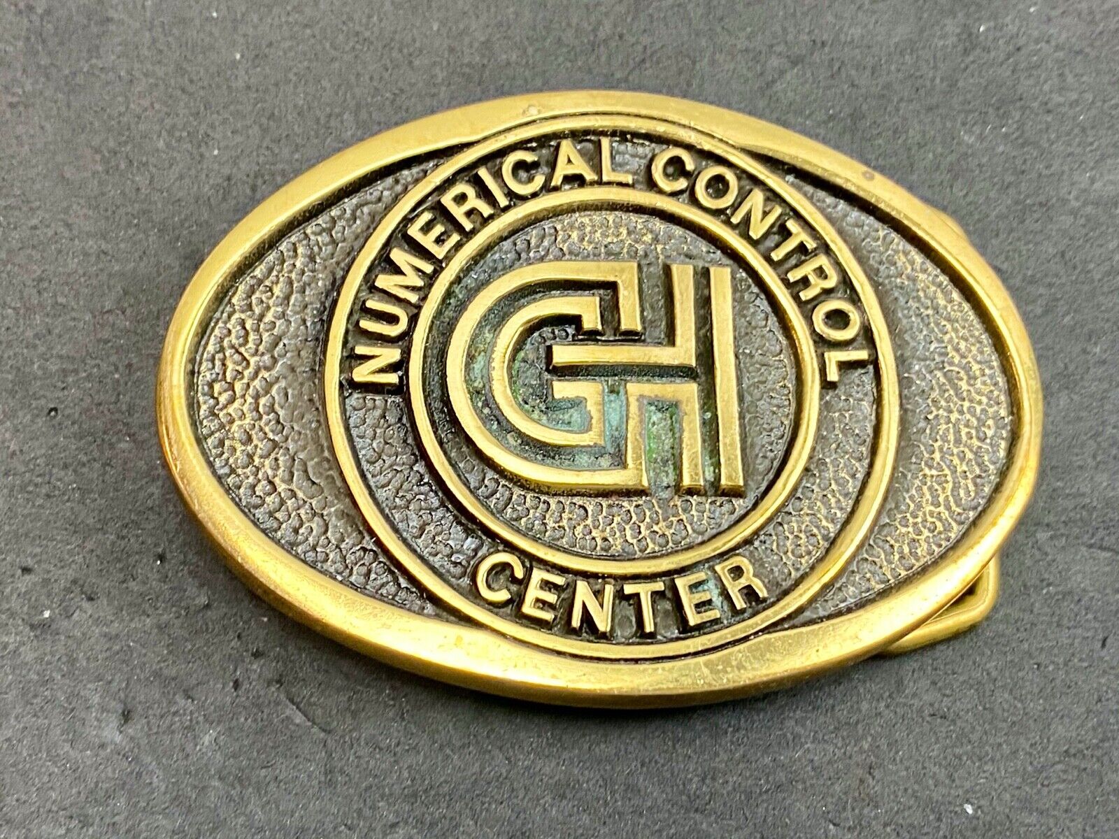 Vintage GH Numerical Control Center solid brass belt buckle by Blue Bayou 