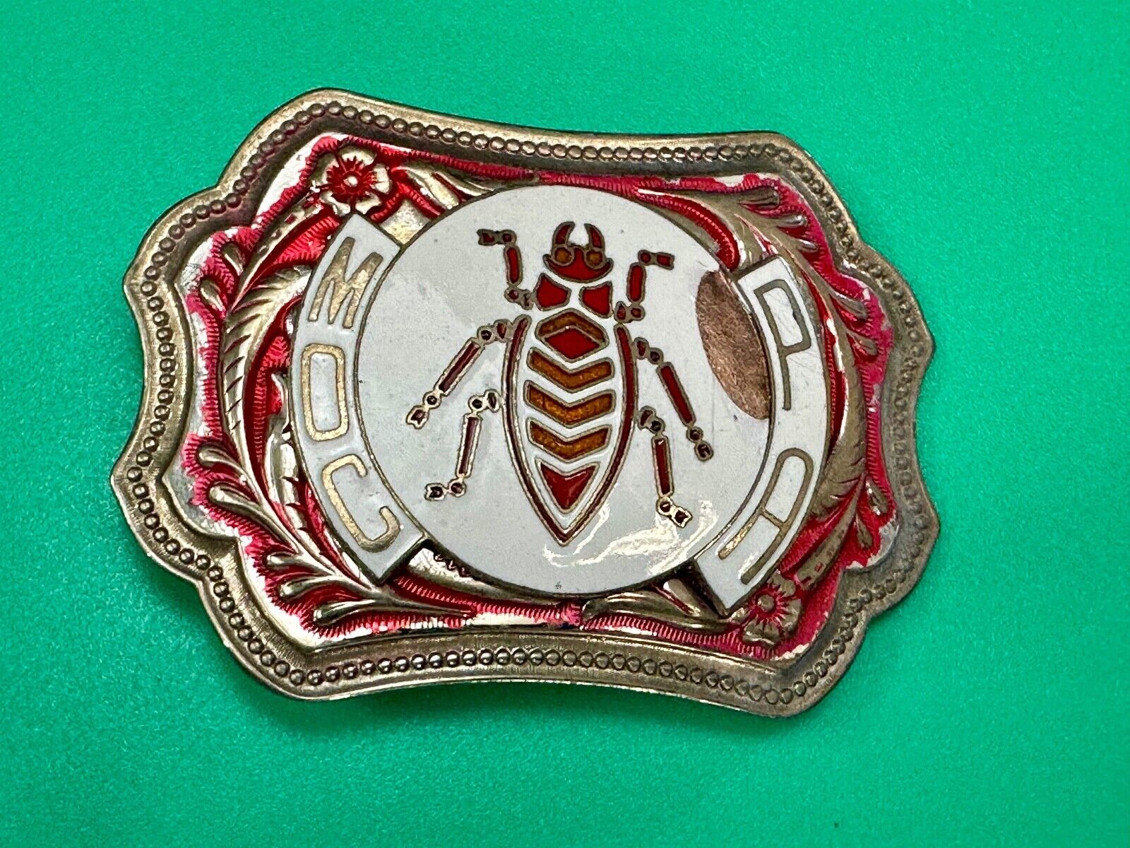 unique insect bug centerpiece on western red & white flower swirl belt buckle
