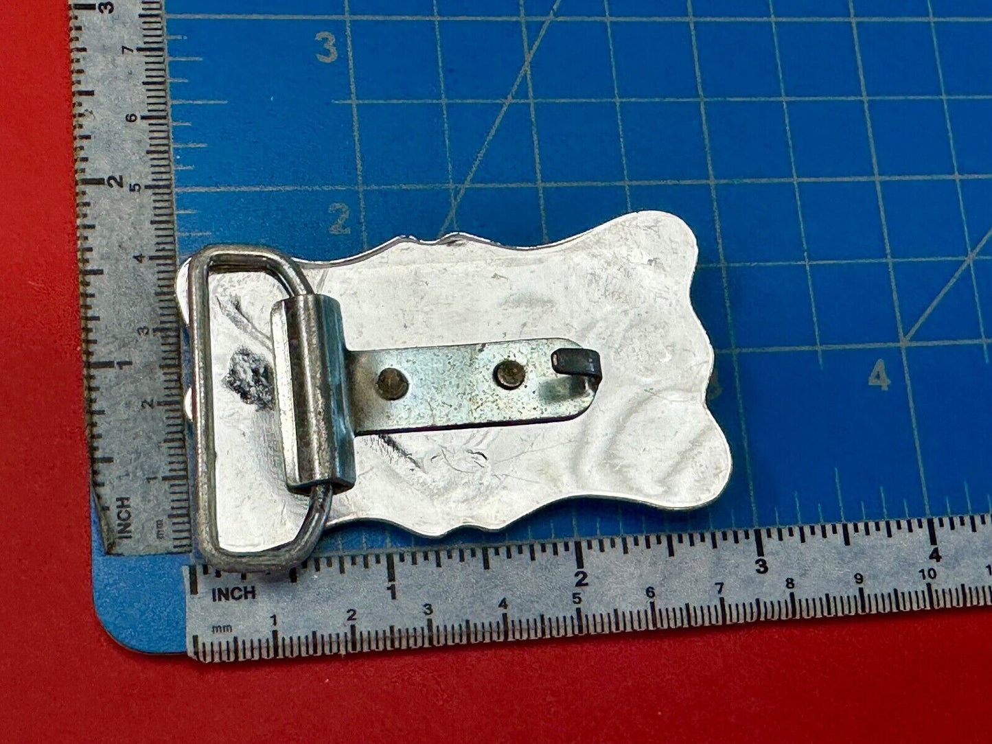 Vintage horse head through lucky horseshoe on reflective western belt buckle