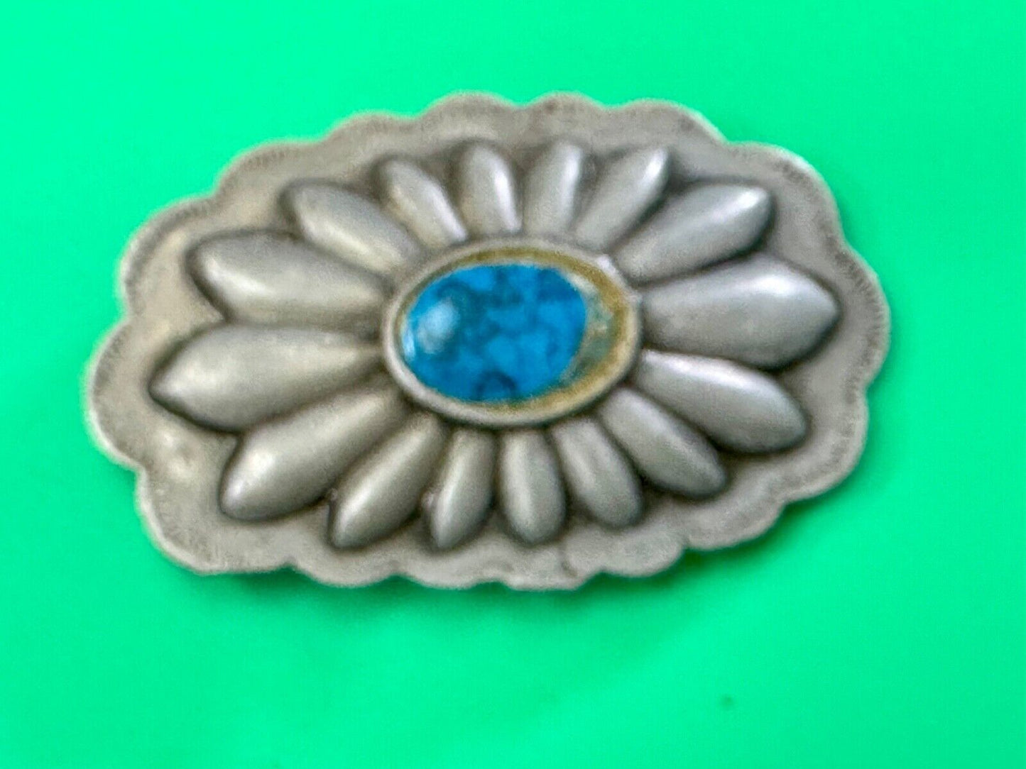 Turquoise stone centered on Vintage metal flower theme belt buckle