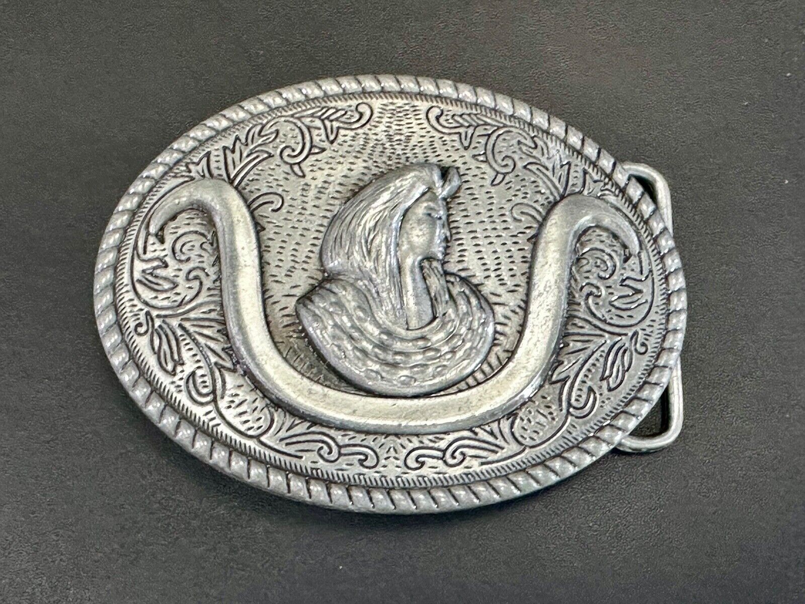 unknown to me!   Man with long hair - longhorn wester belt buckle