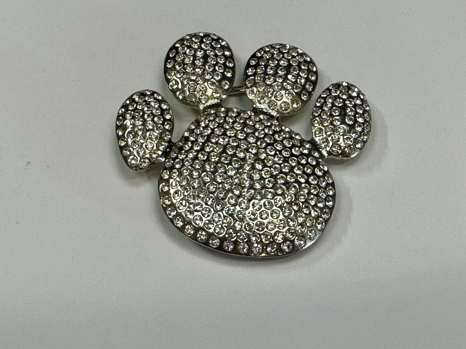 Bear Paw Print Silver Tone rhinestone covered belt buckle